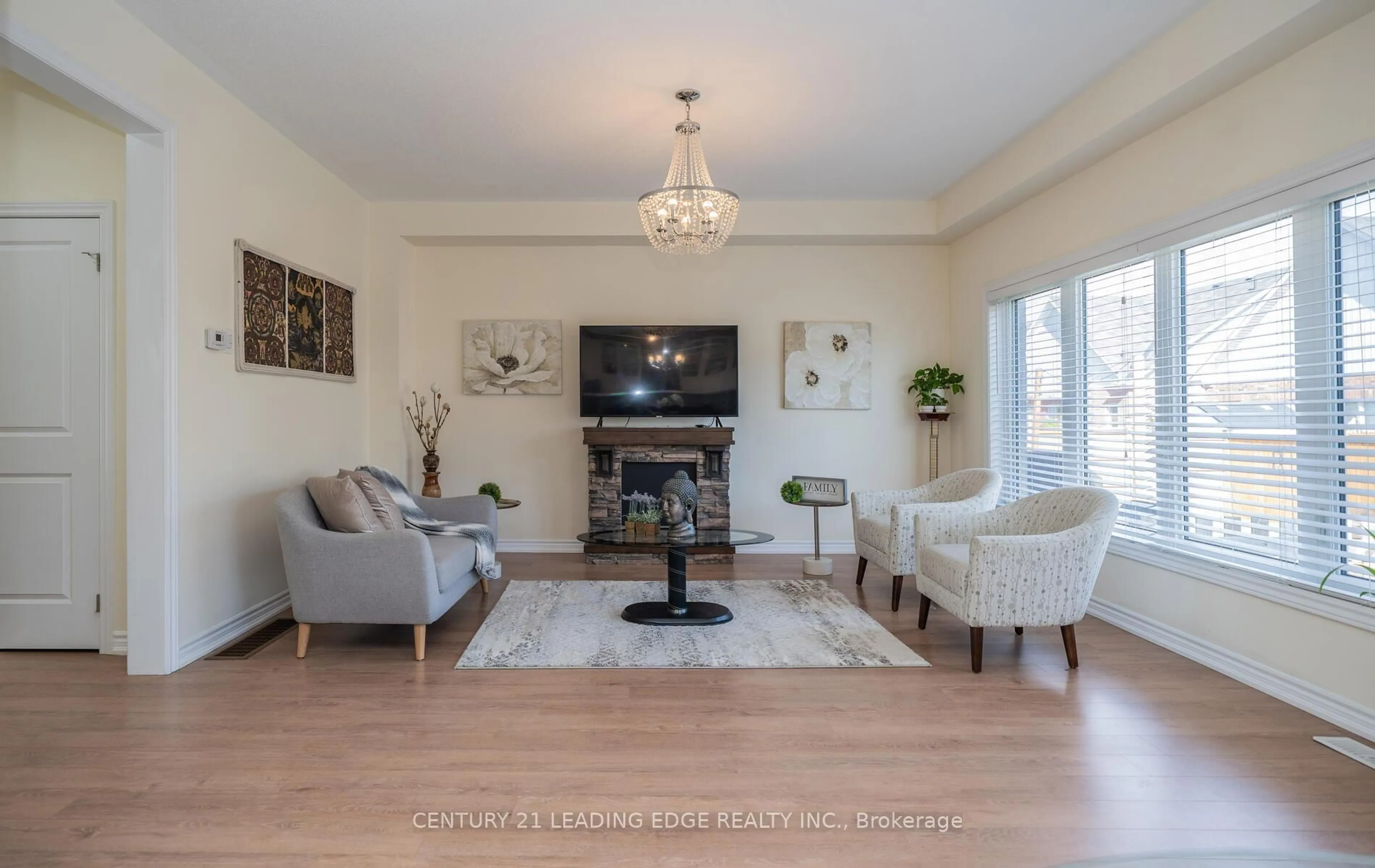 Living room with furniture, wood/laminate floor for 164 Allegra Dr, Wasaga Beach Ontario L9Z 0H6