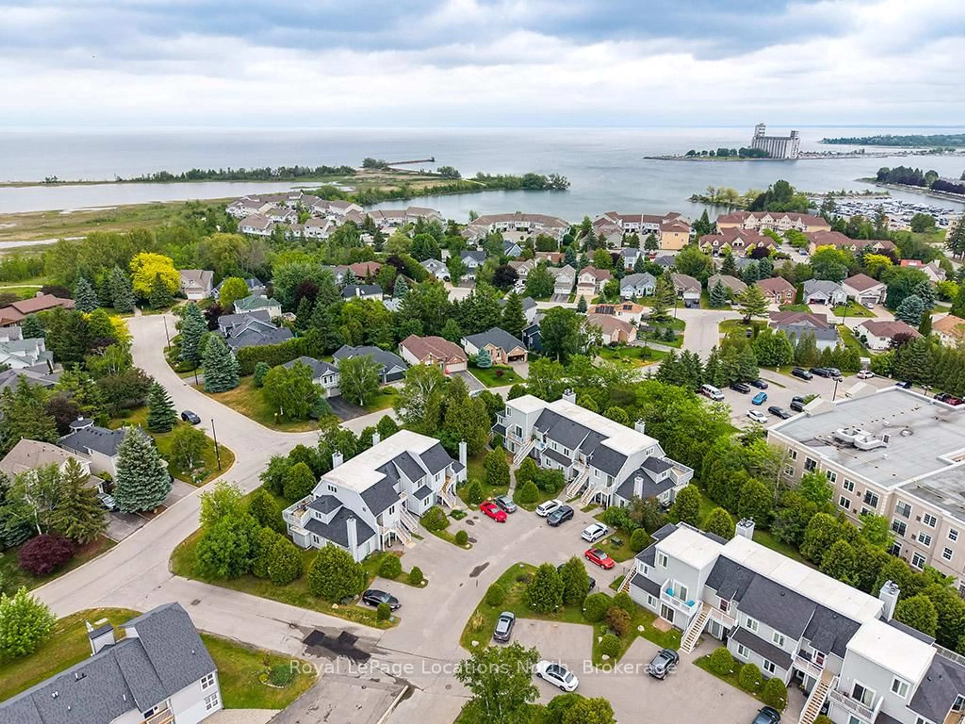 A pic from outside/outdoor area/front of a property/back of a property/a pic from drone, water/lake/river/ocean view for 55 Trott Blvd #115, Collingwood Ontario L9Y 4B8