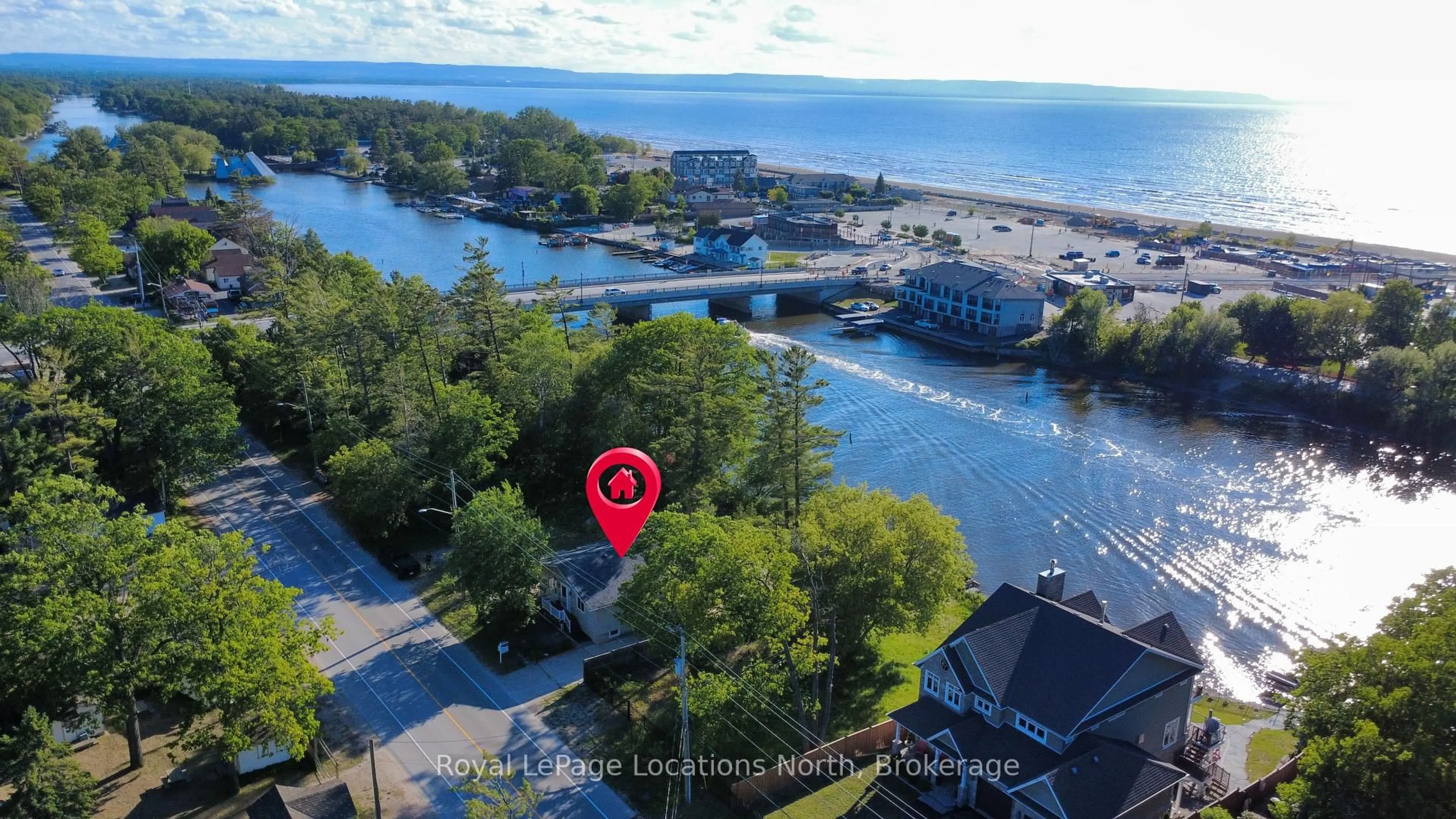 A pic from outside/outdoor area/front of a property/back of a property/a pic from drone, water/lake/river/ocean view for 32 River Rd, Wasaga Beach Ontario L9Z 2L1