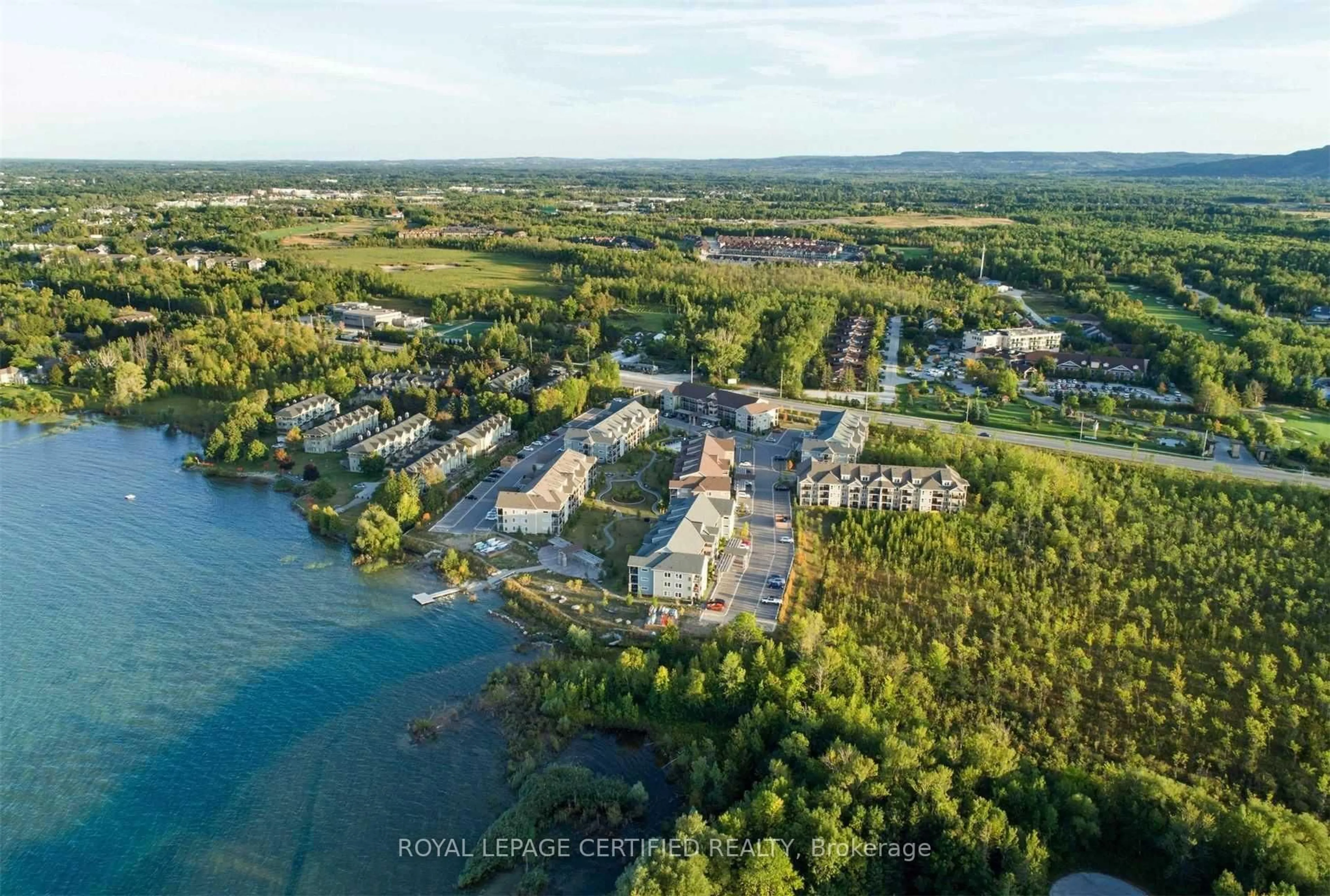 A pic from outside/outdoor area/front of a property/back of a property/a pic from drone, water/lake/river/ocean view for 6 Anchorage Cres #308, Collingwood Ontario L9Y 0Y6