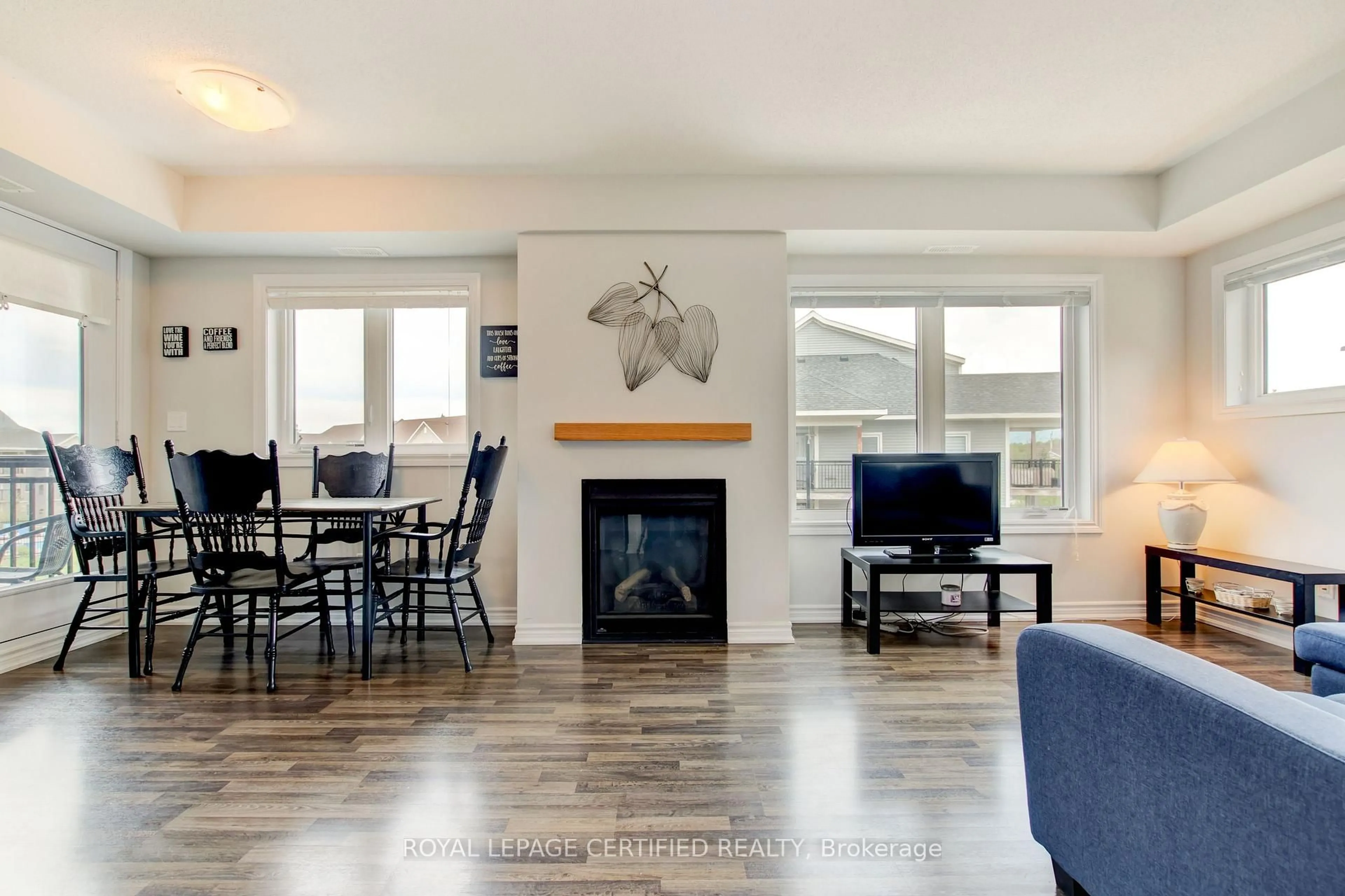 Living room with furniture, wood/laminate floor for 6 Anchorage Cres #308, Collingwood Ontario L9Y 0Y6