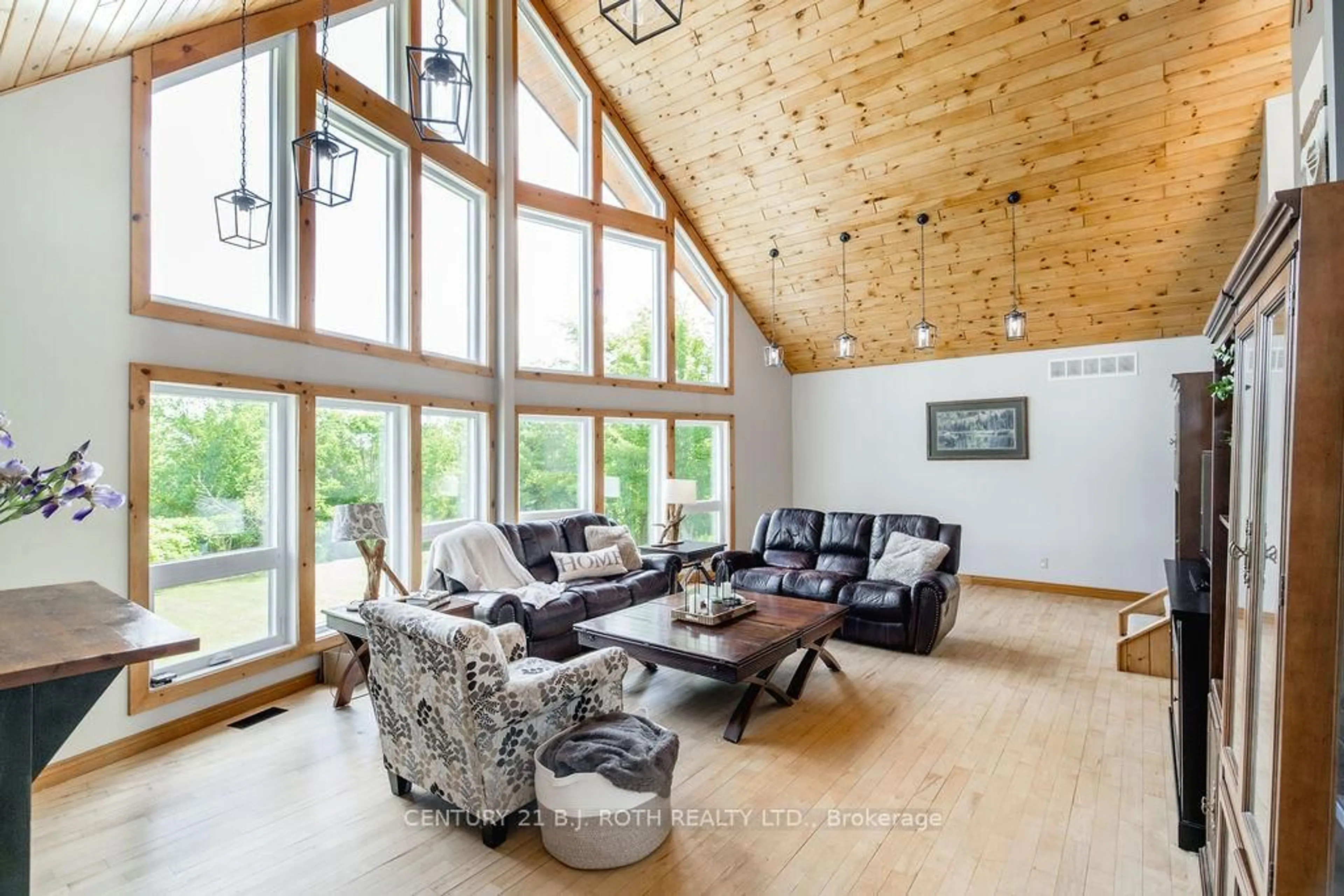 Living room with furniture, wood/laminate floor for 2711 Foxmead Rd, Oro-Medonte Ontario L0K 1E0
