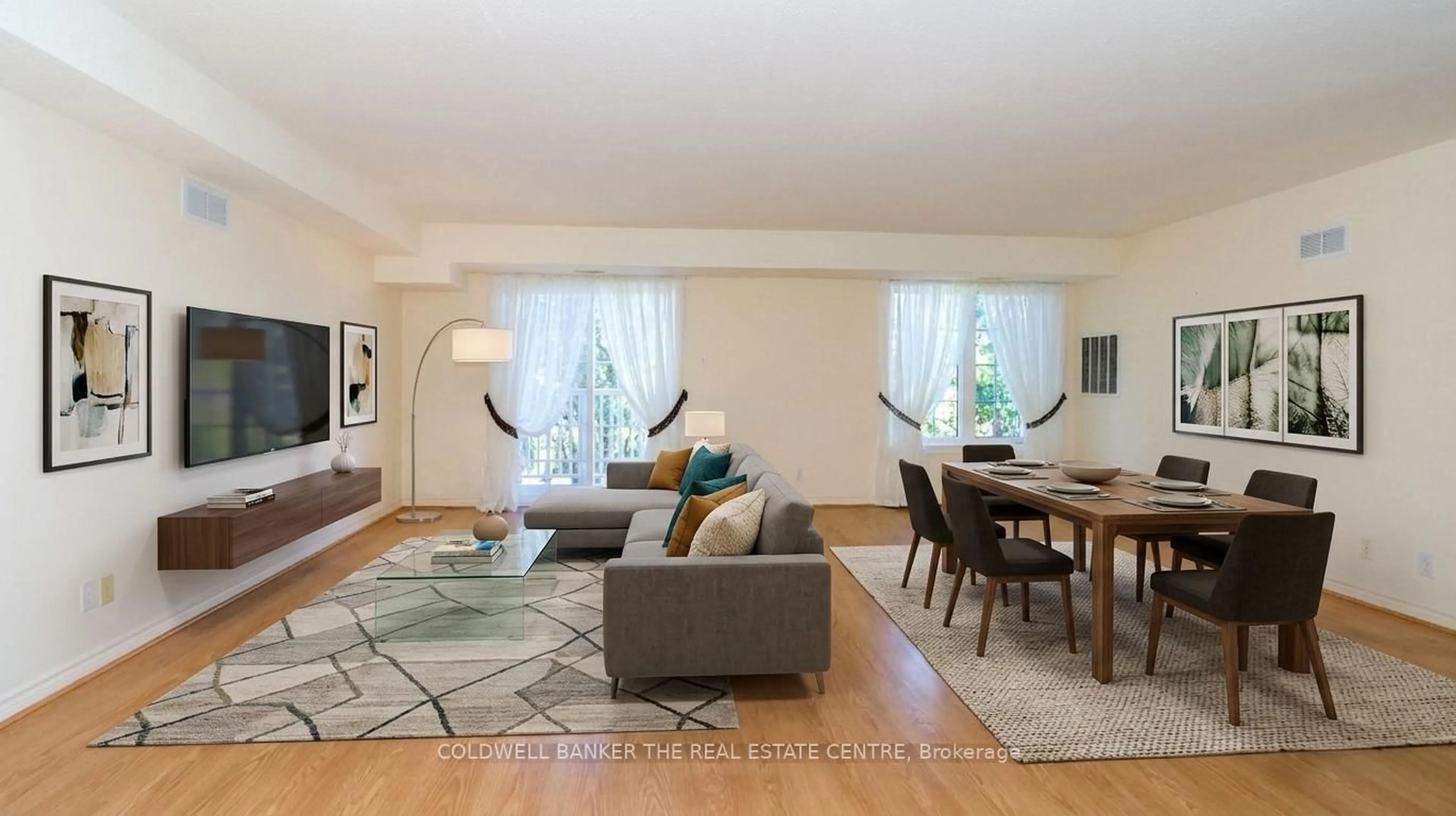 Living room with furniture, wood/laminate floor for 49 Jacobs Terr #212, Barrie Ontario L4N 0W4