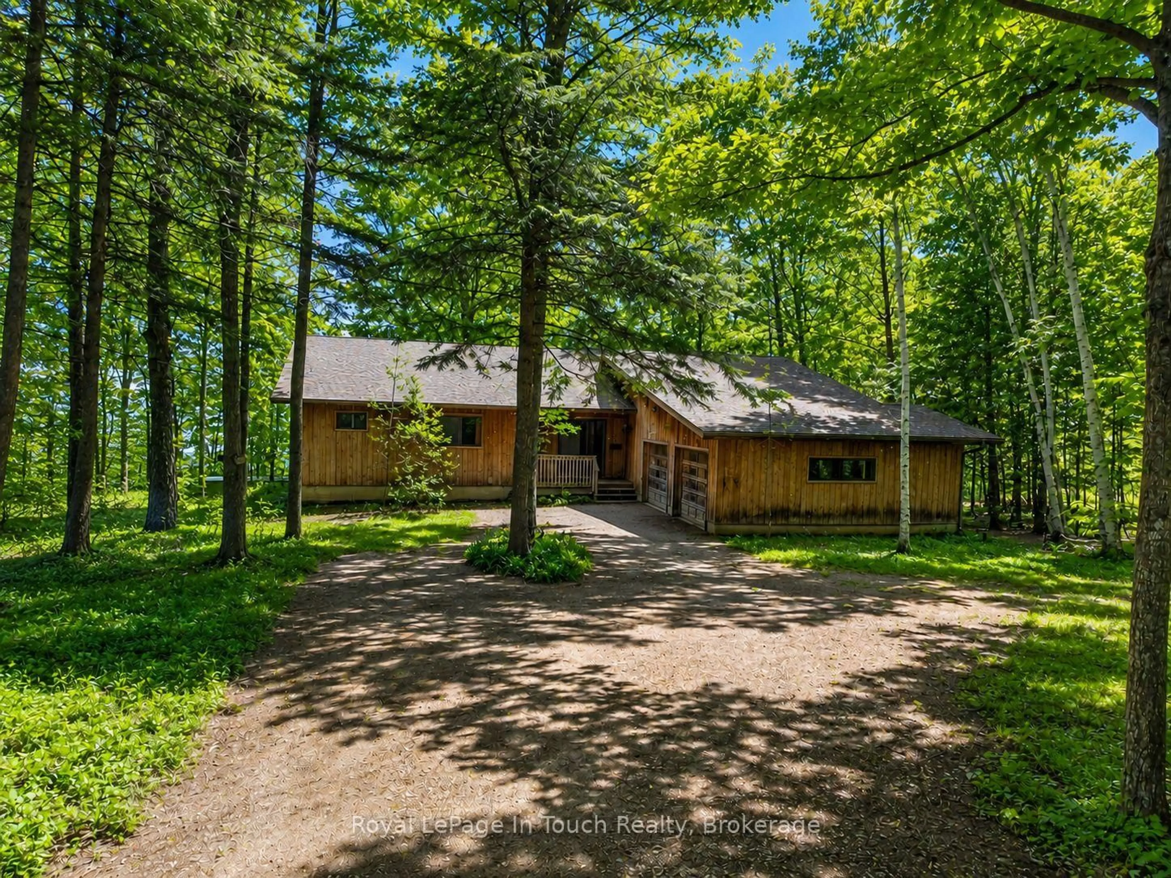 A pic from outside/outdoor area/front of a property/back of a property/a pic from drone, forest/trees view for 54 Lackie Cres, Tiny Ontario L0L 2J0
