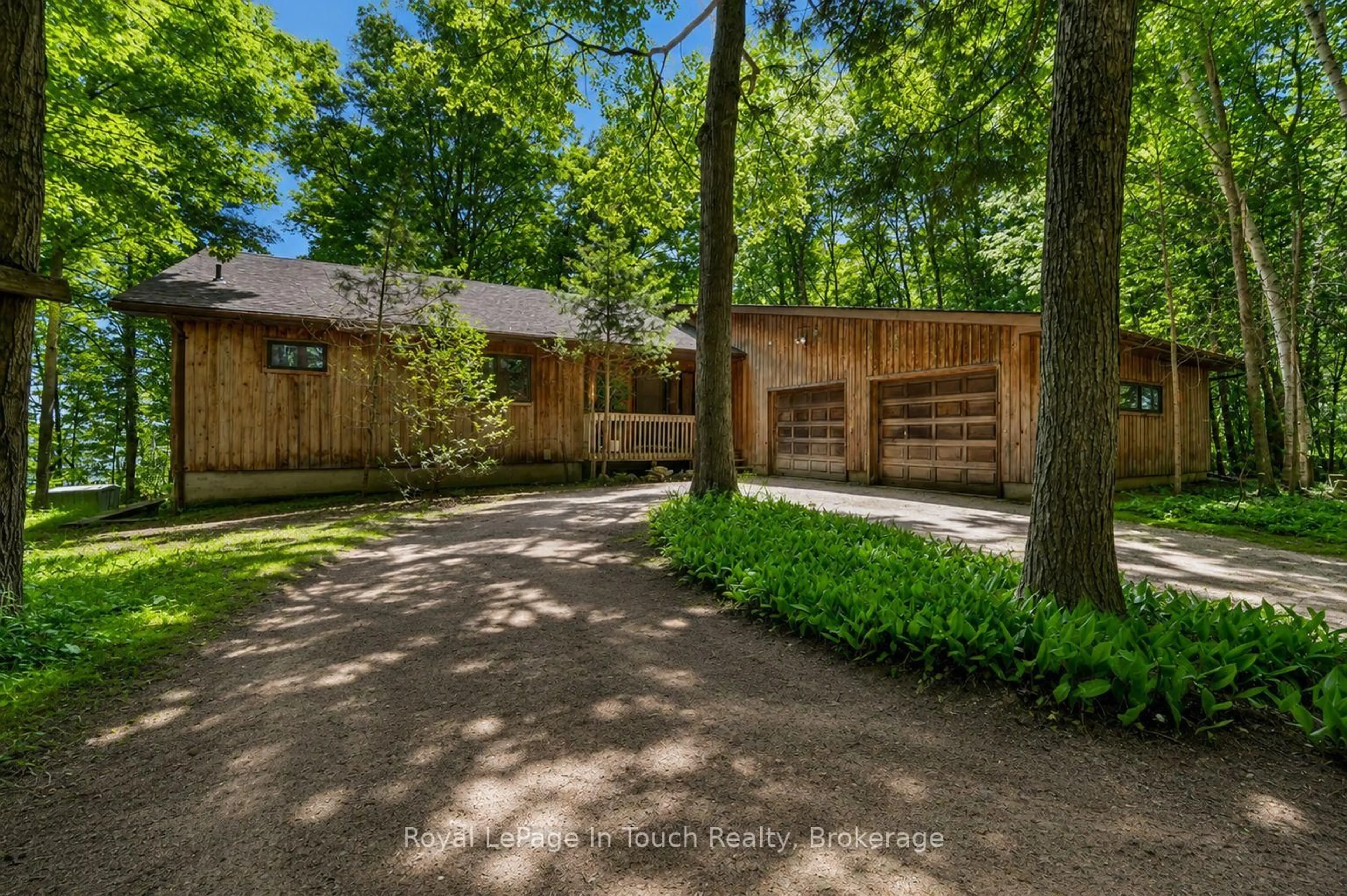 A pic from outside/outdoor area/front of a property/back of a property/a pic from drone, forest/trees view for 54 Lackie Cres, Tiny Ontario L0L 2J0