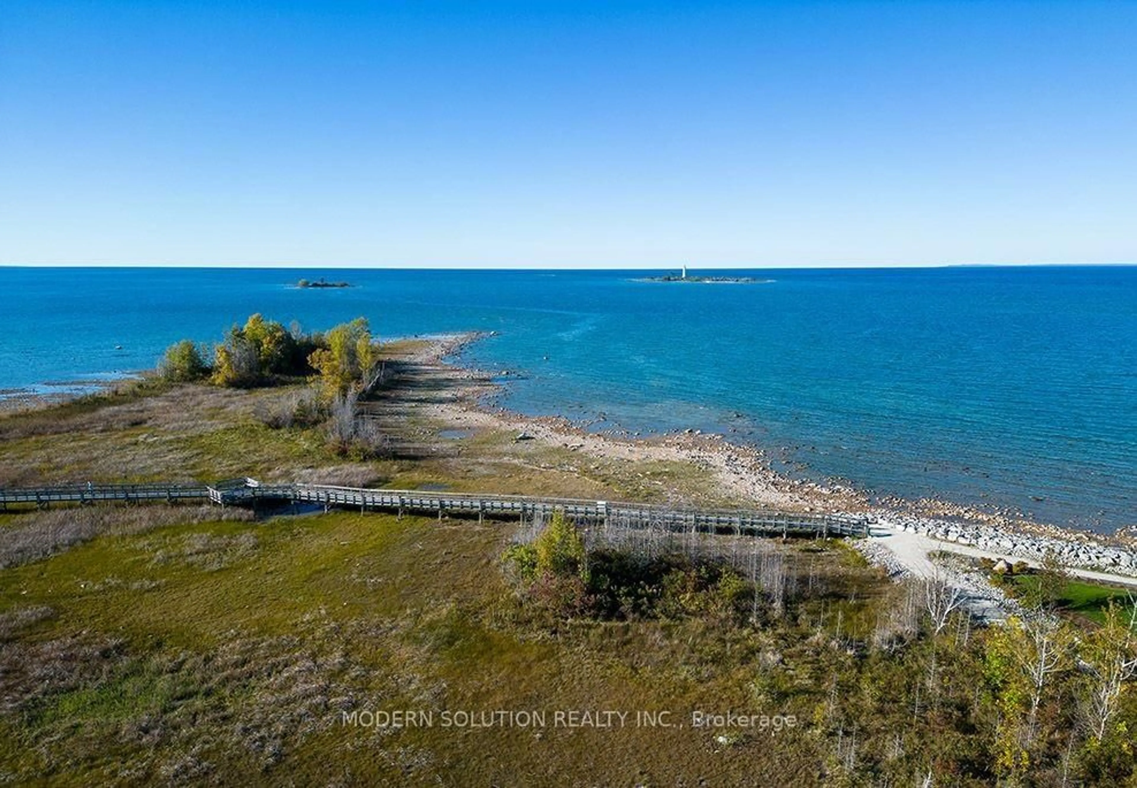 A pic from outside/outdoor area/front of a property/back of a property/a pic from drone, water/lake/river/ocean view for 307 Mariners Way, Collingwood Ontario L9Y 5C7