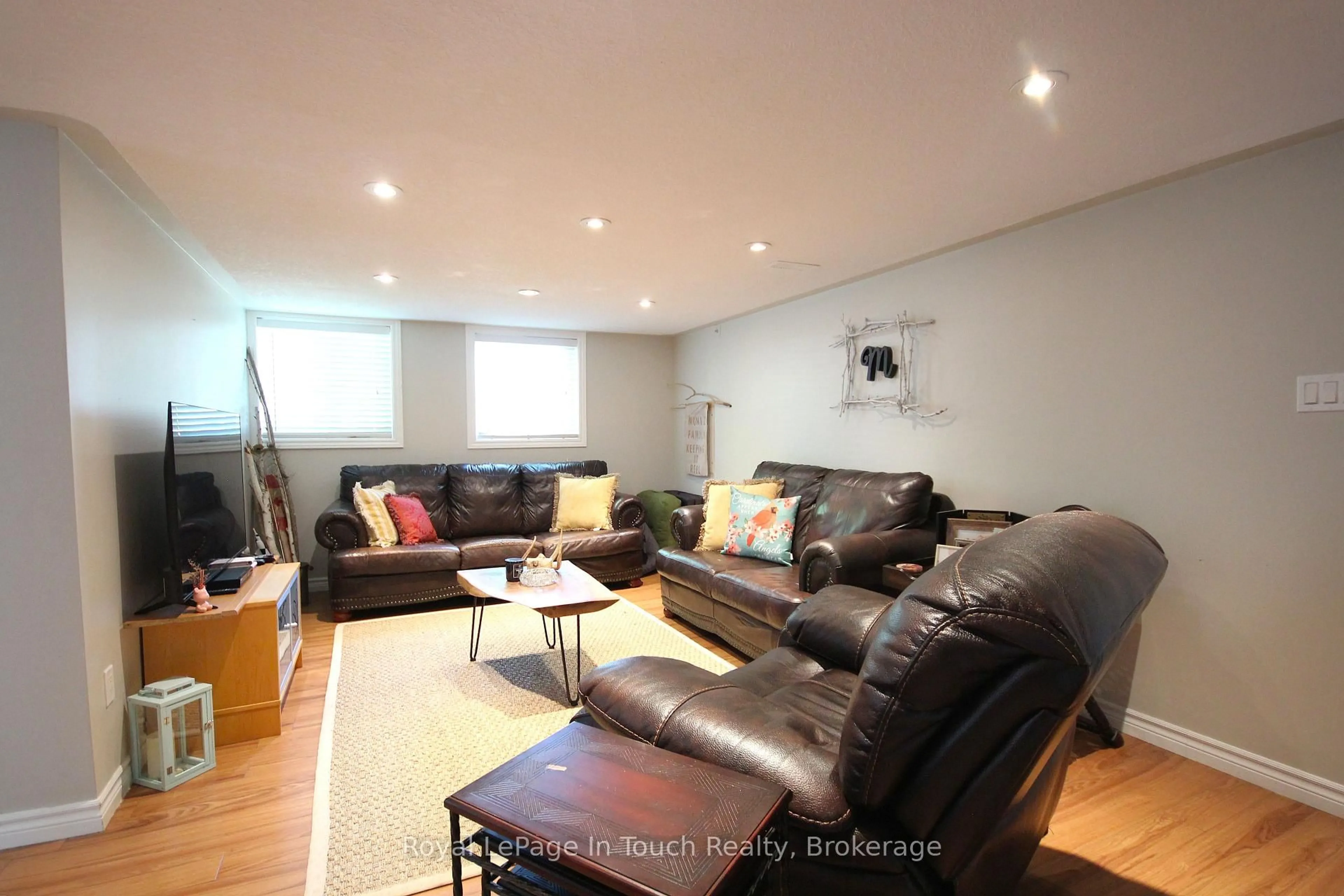 Living room with furniture, wood/laminate floor for 46 Long Point Rd, Tay Ontario L0K 1E0
