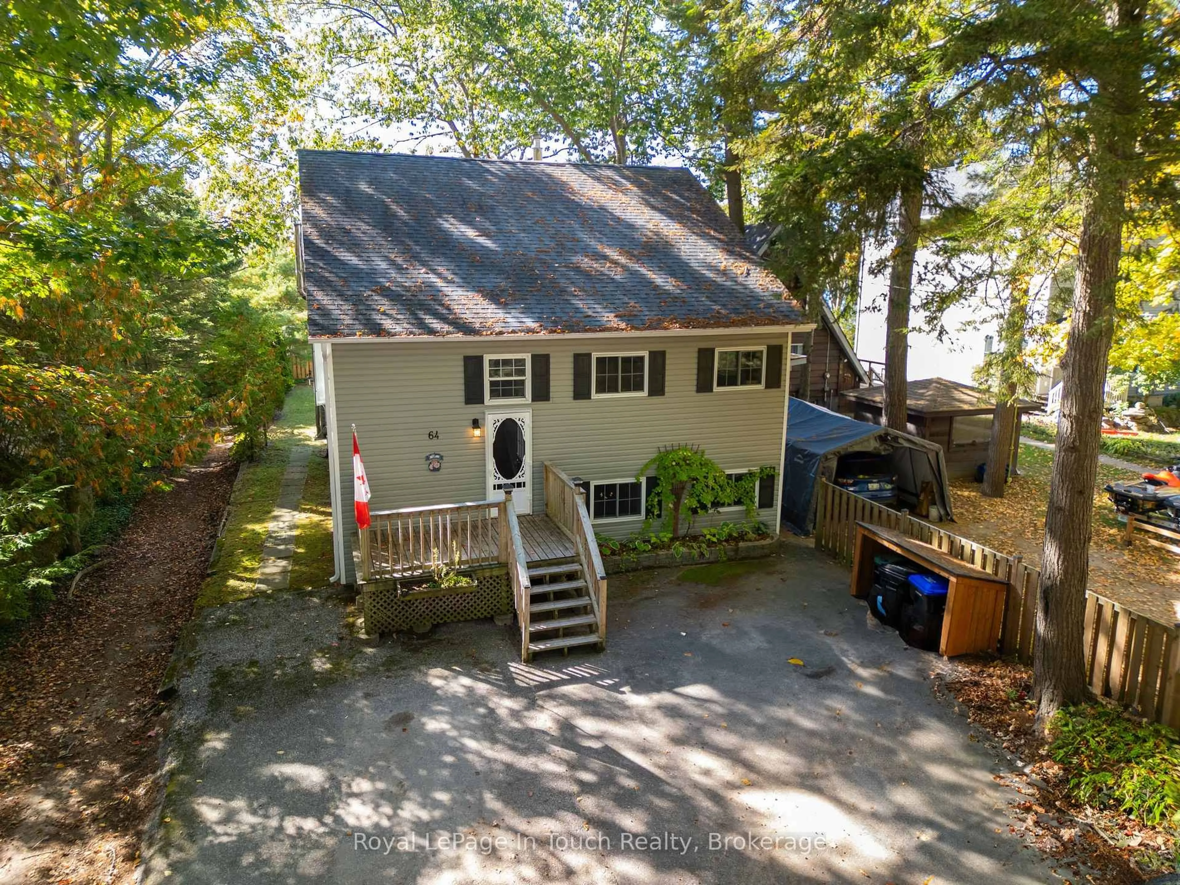 A pic from outside/outdoor area/front of a property/back of a property/a pic from drone, street for 64 Wahnekewening Dr, Tiny Ontario L0L 2J0