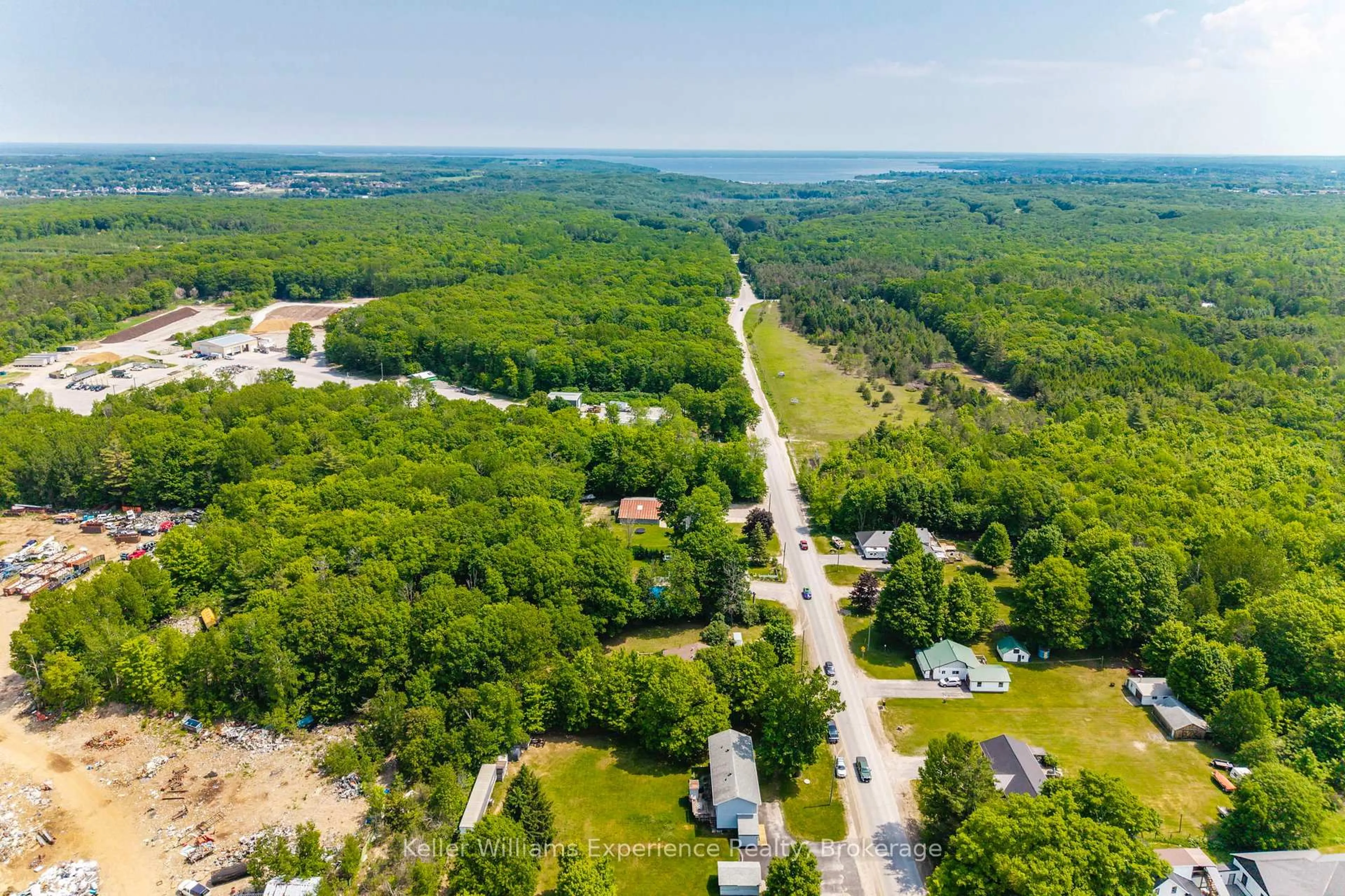 A pic from outside/outdoor area/front of a property/back of a property/a pic from drone, forest/trees view for 1720 Golflink Rd, Tiny Ontario L0L 2J0