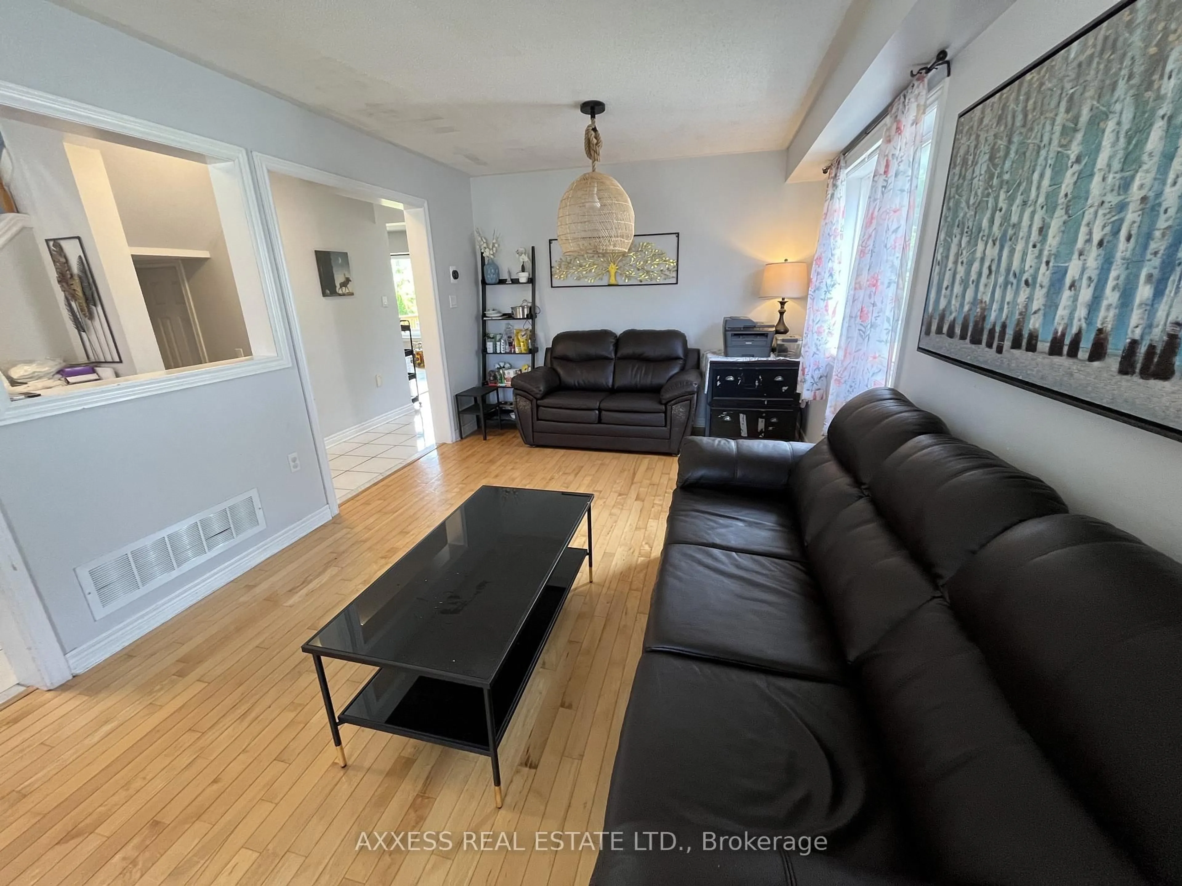 Living room with furniture, wood/laminate floor for 234 Esther Dr, Barrie Ontario L4N 0G3