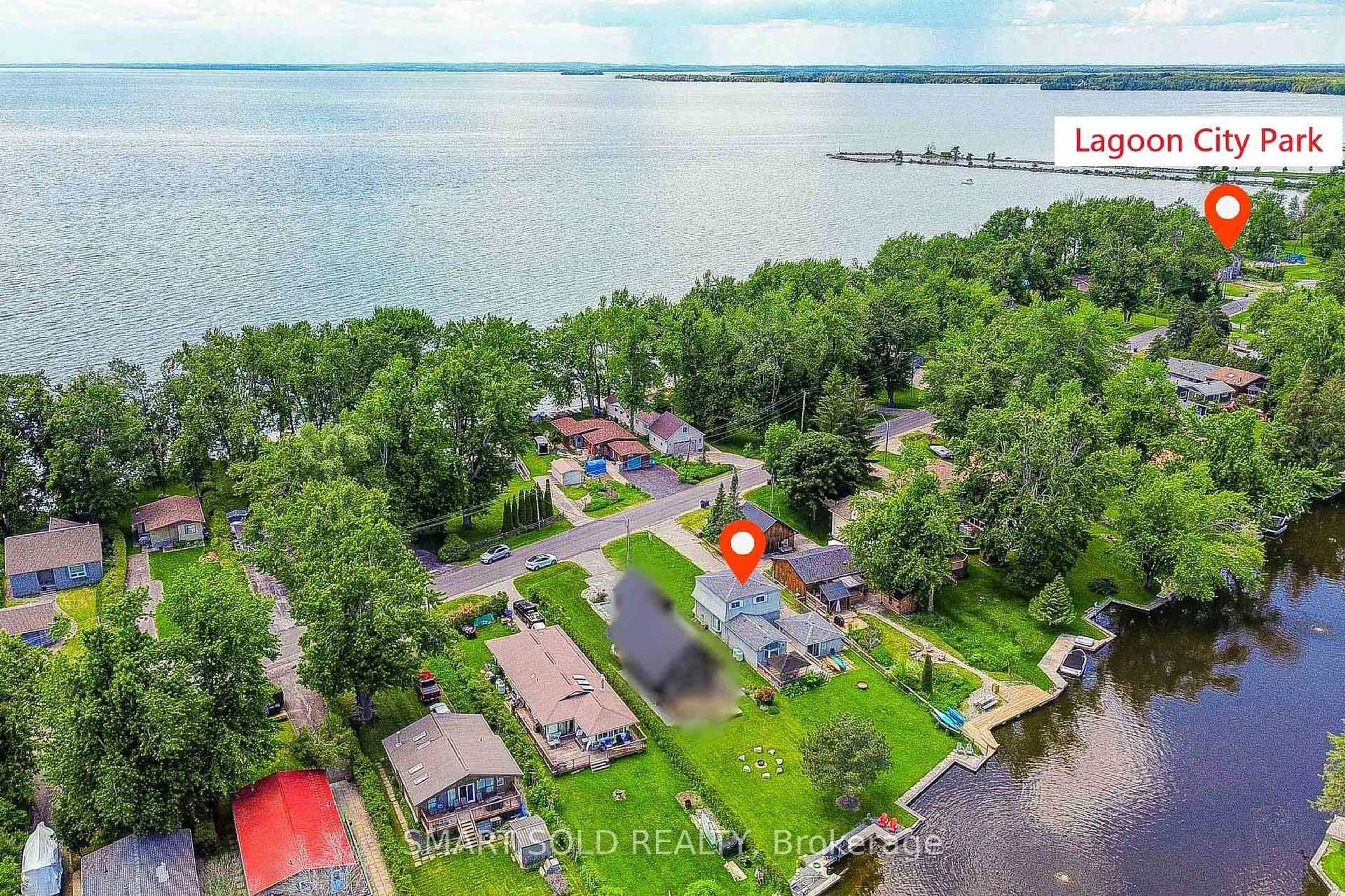 A pic from outside/outdoor area/front of a property/back of a property/a pic from drone, water/lake/river/ocean view for 75 Lake Ave, Ramara Ontario L0K 1B0