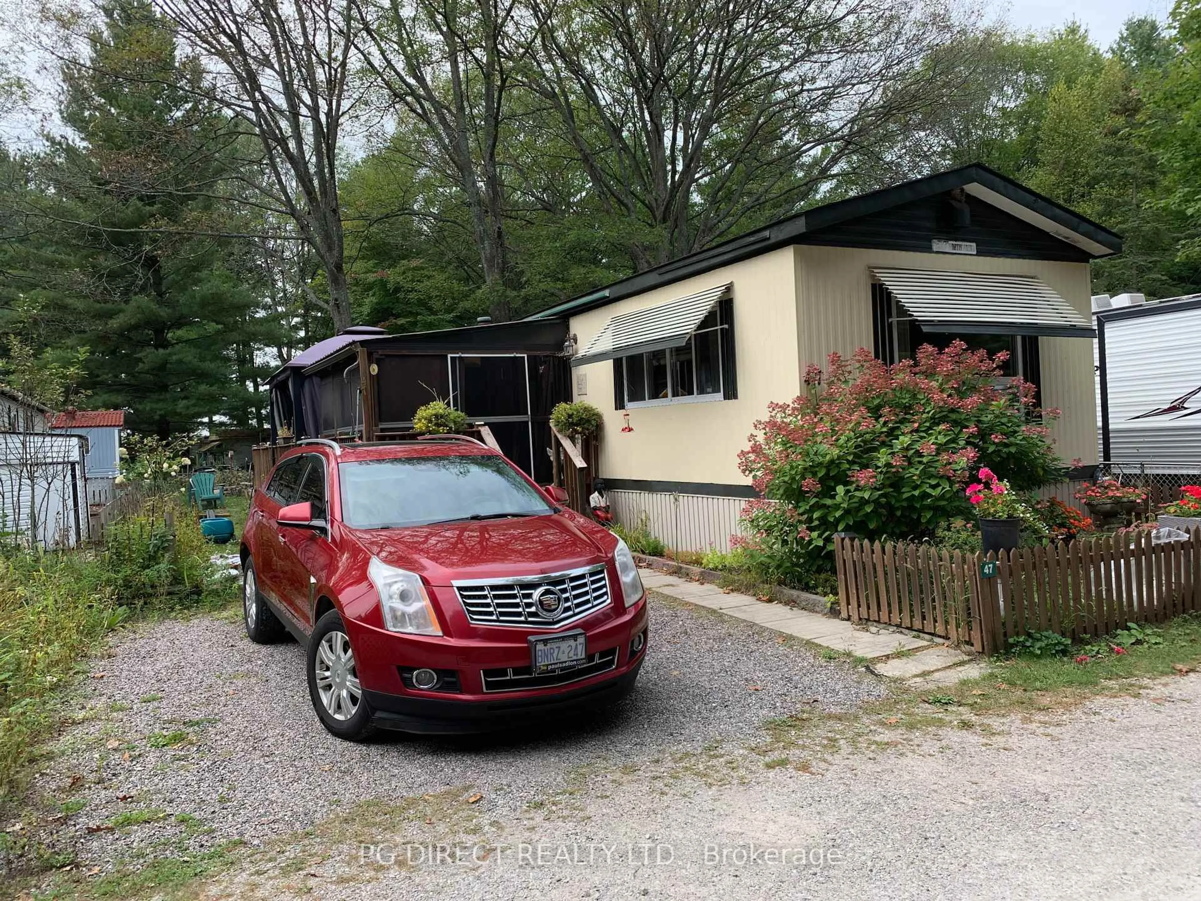 A pic from outside/outdoor area/front of a property/back of a property/a pic from drone, street for 5216 COUNTY RD. 90 Rd #LOT 47, Springwater Ontario L4M 1T0