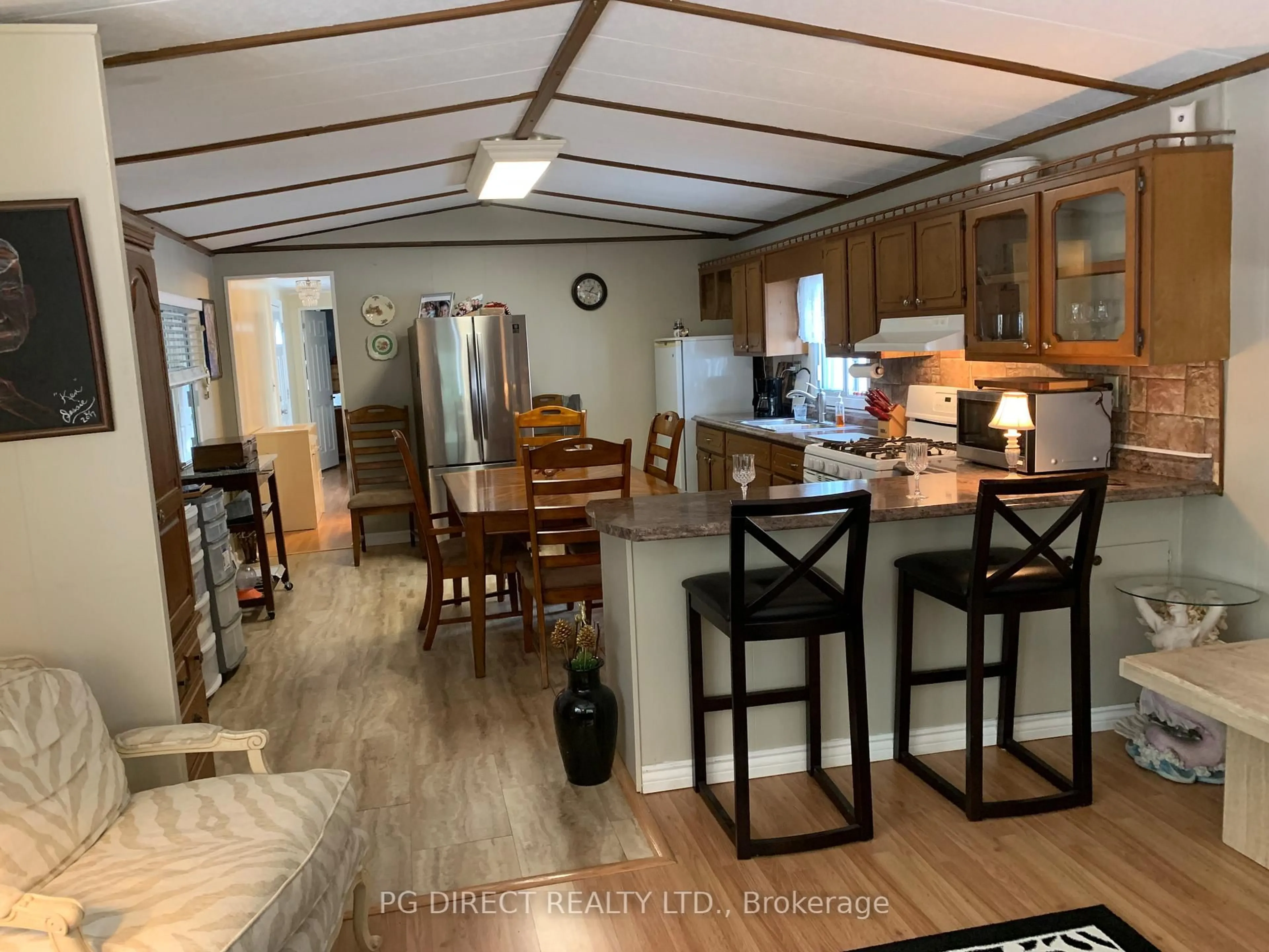 Open concept kitchen, wood/laminate floor for 5216 COUNTY RD. 90 Rd #LOT 47, Springwater Ontario L4M 1T0