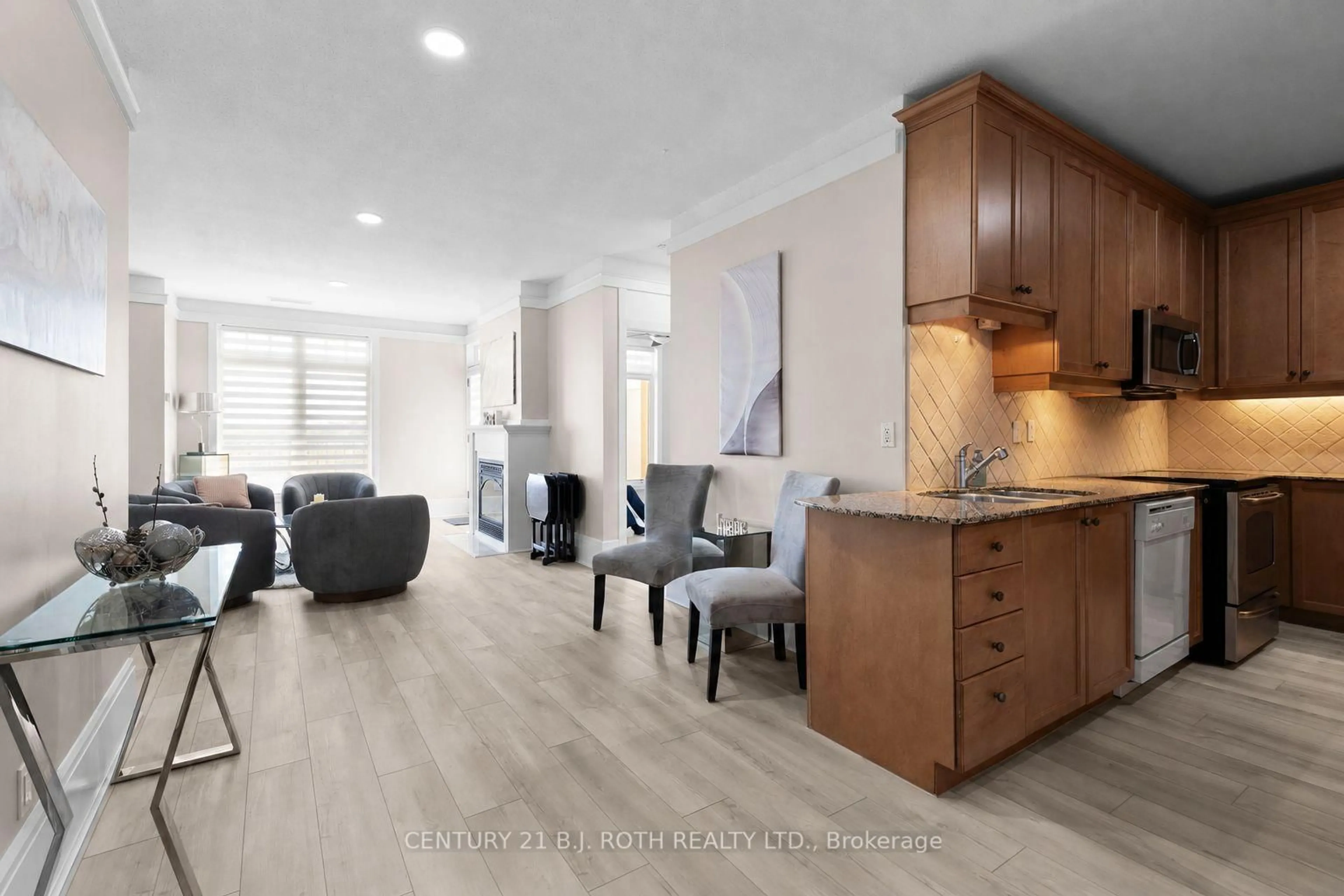 Living room with furniture, wood/laminate floor for 140 Cedar Island Rd #313, Orillia Ontario L3V 1T1