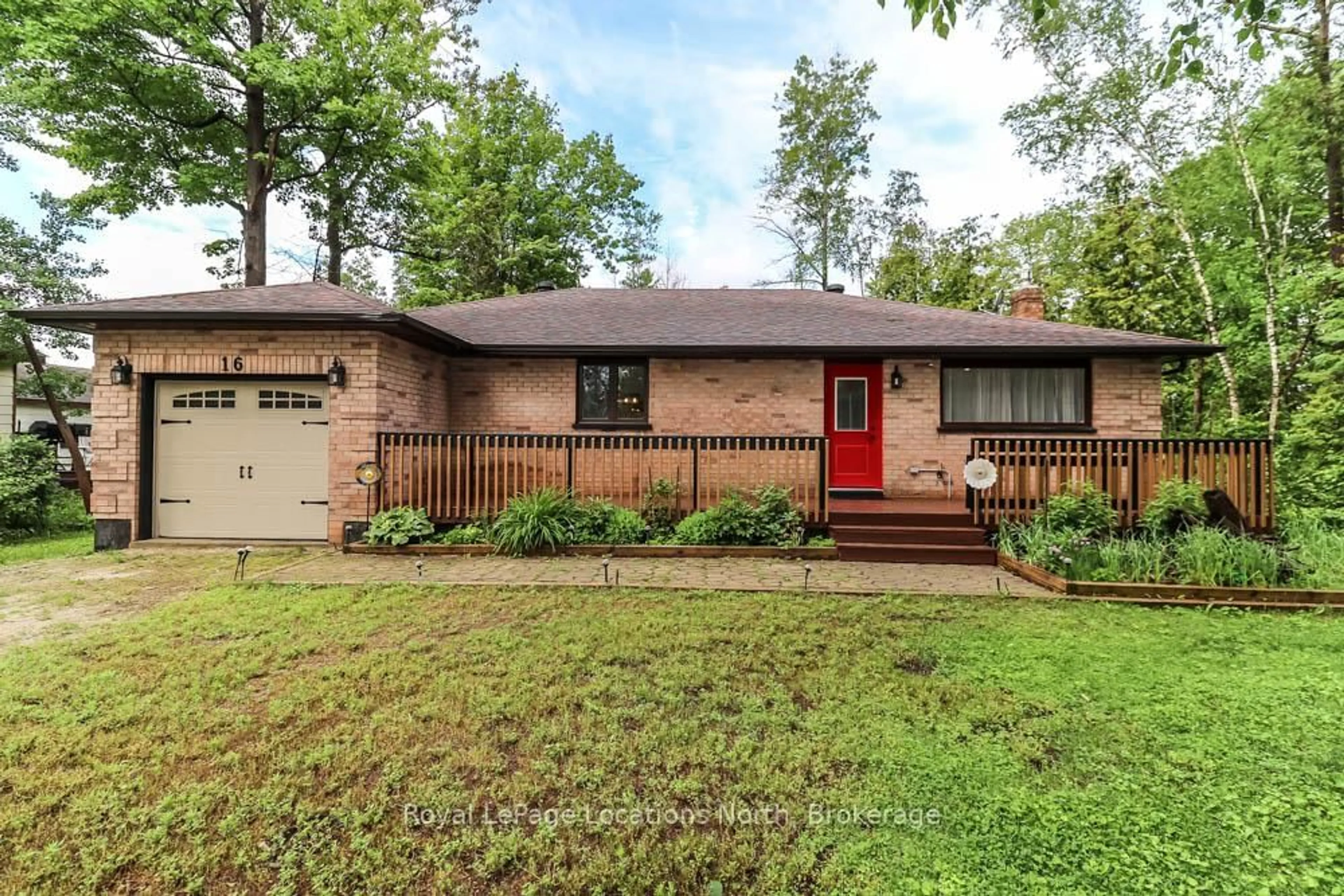 Home with brick exterior material, street for 16 Wood Ave, Wasaga Beach Ontario L9Z 2L3