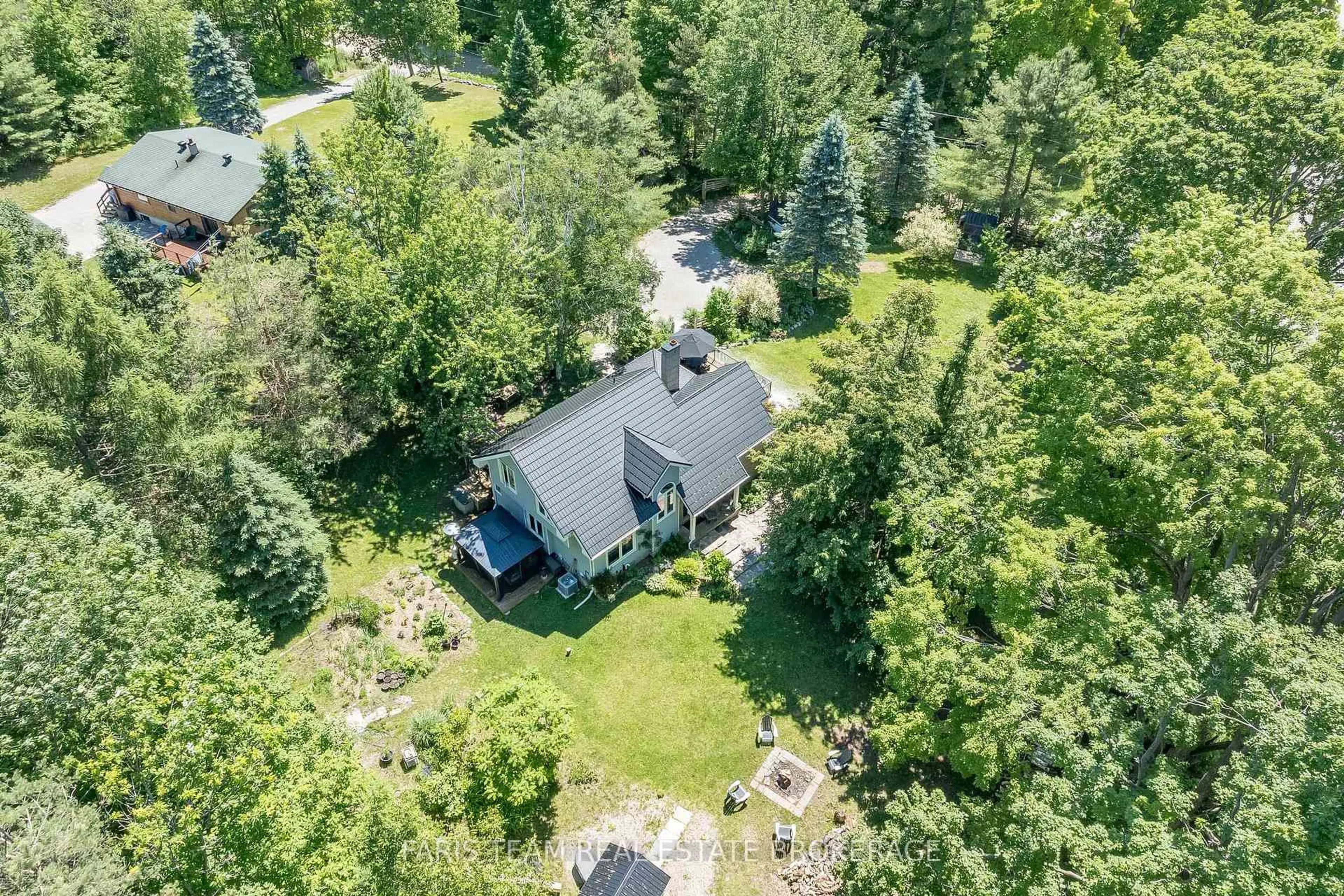 A pic from outside/outdoor area/front of a property/back of a property/a pic from drone, forest/trees view for 2268 Flos Road 10, Springwater Ontario L0L 1P0