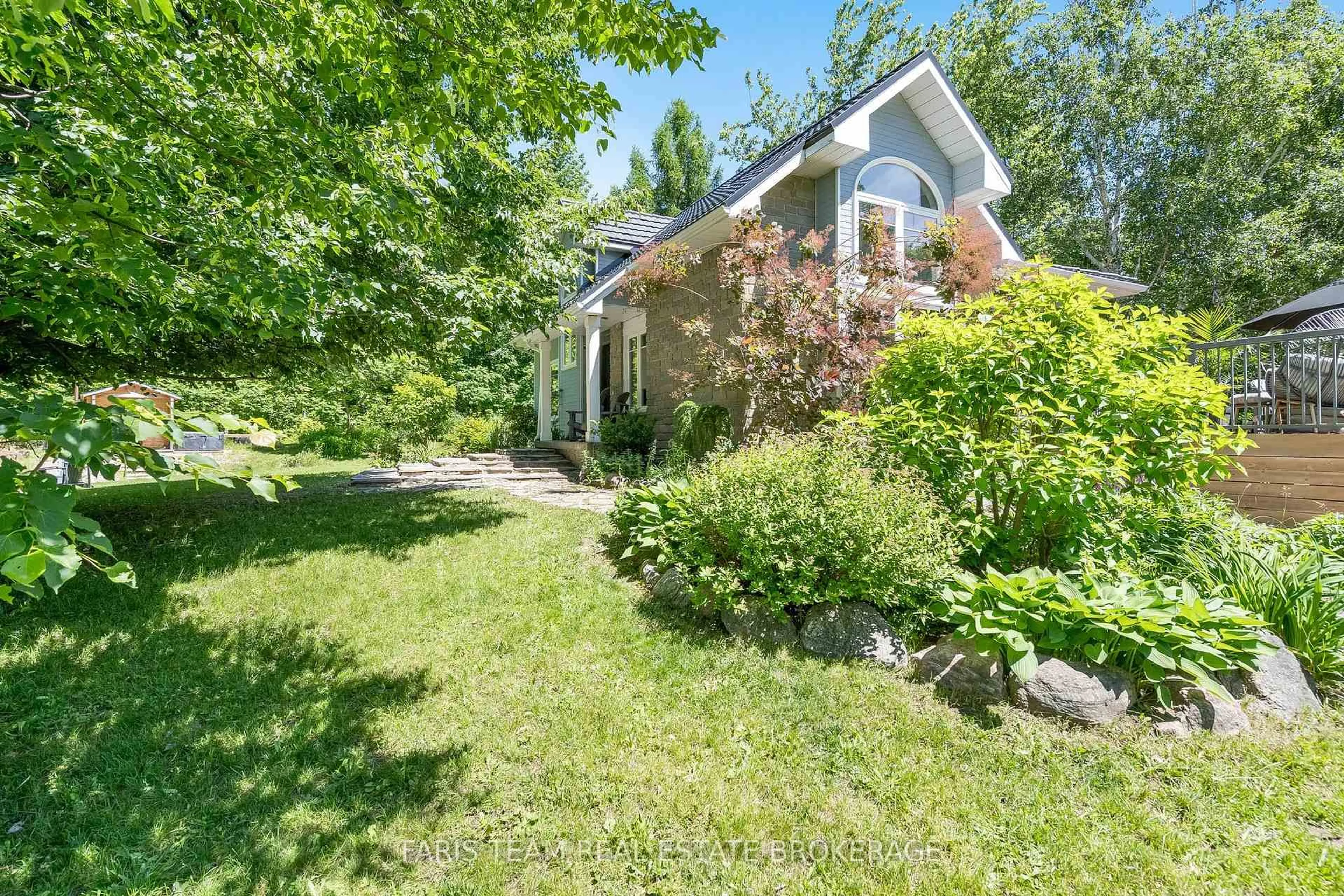 A pic from outside/outdoor area/front of a property/back of a property/a pic from drone, unknown for 2268 Flos Road 10, Springwater Ontario L0L 1P0