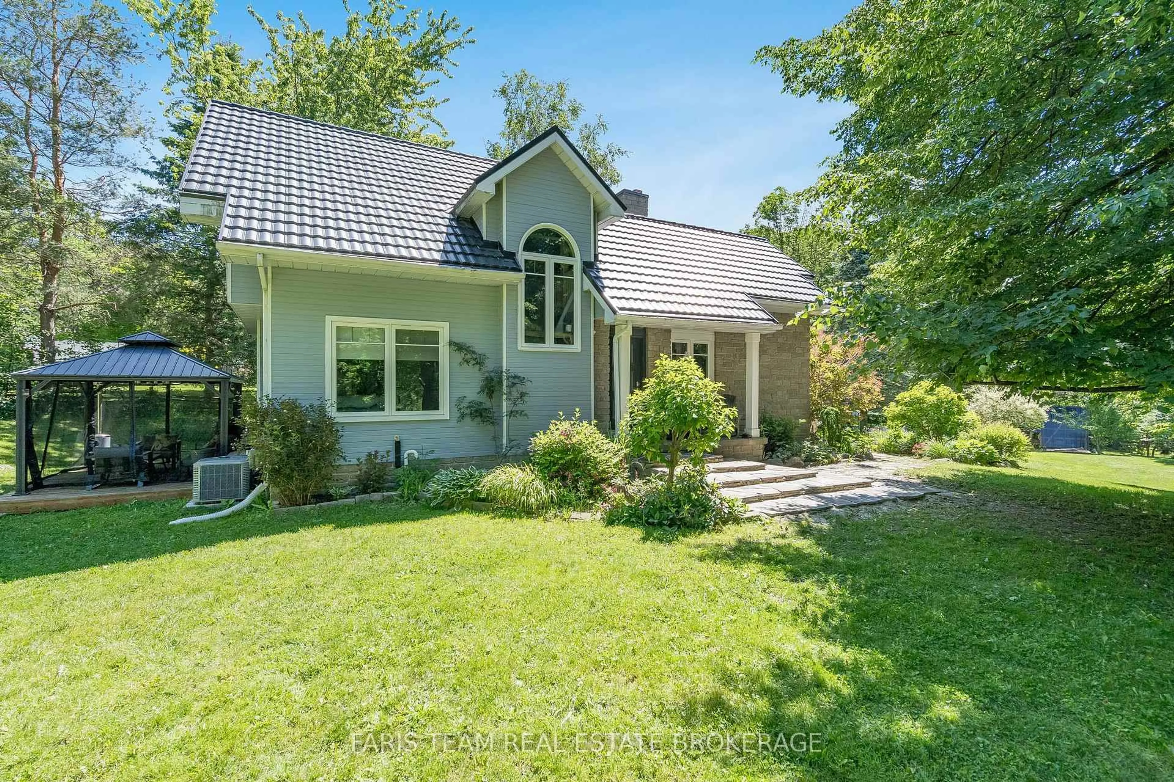 A pic from outside/outdoor area/front of a property/back of a property/a pic from drone, unknown for 2268 Flos Road 10, Springwater Ontario L0L 1P0
