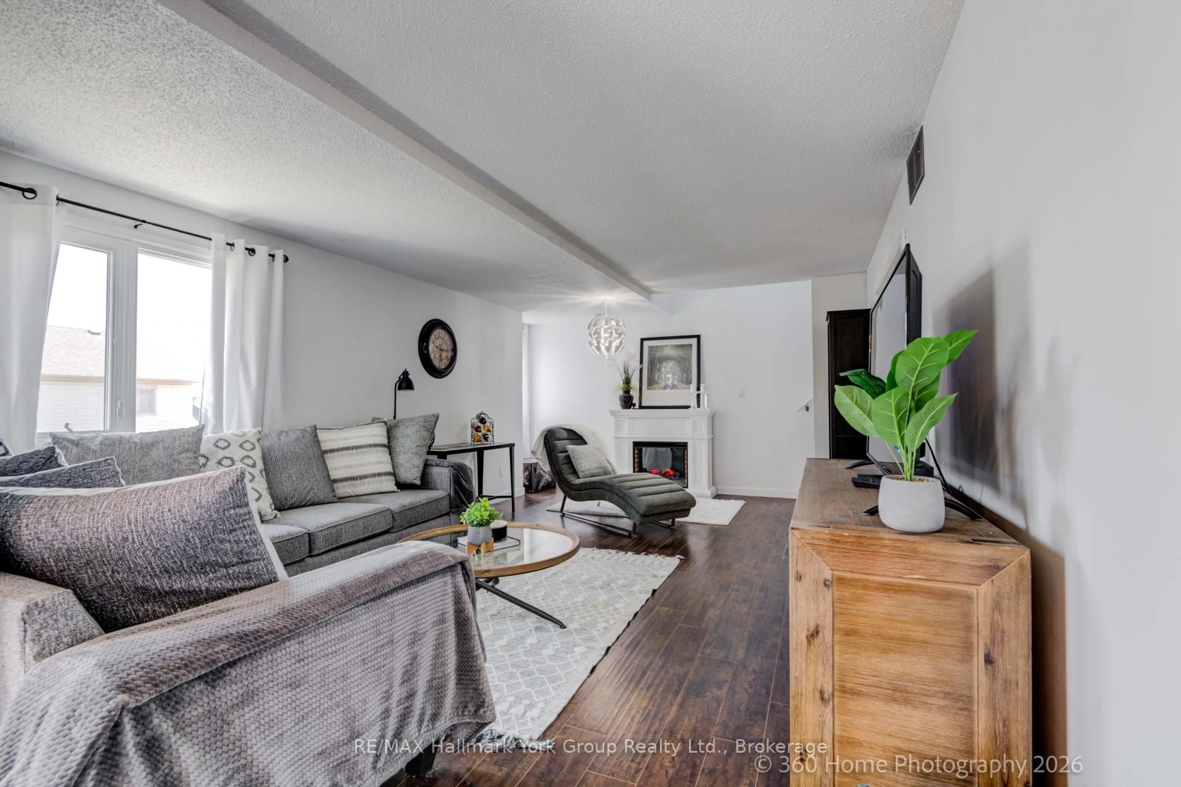Living room with furniture, wood/laminate floor for 502 ESSA Rd #16, Barrie Ontario L4N 7L4