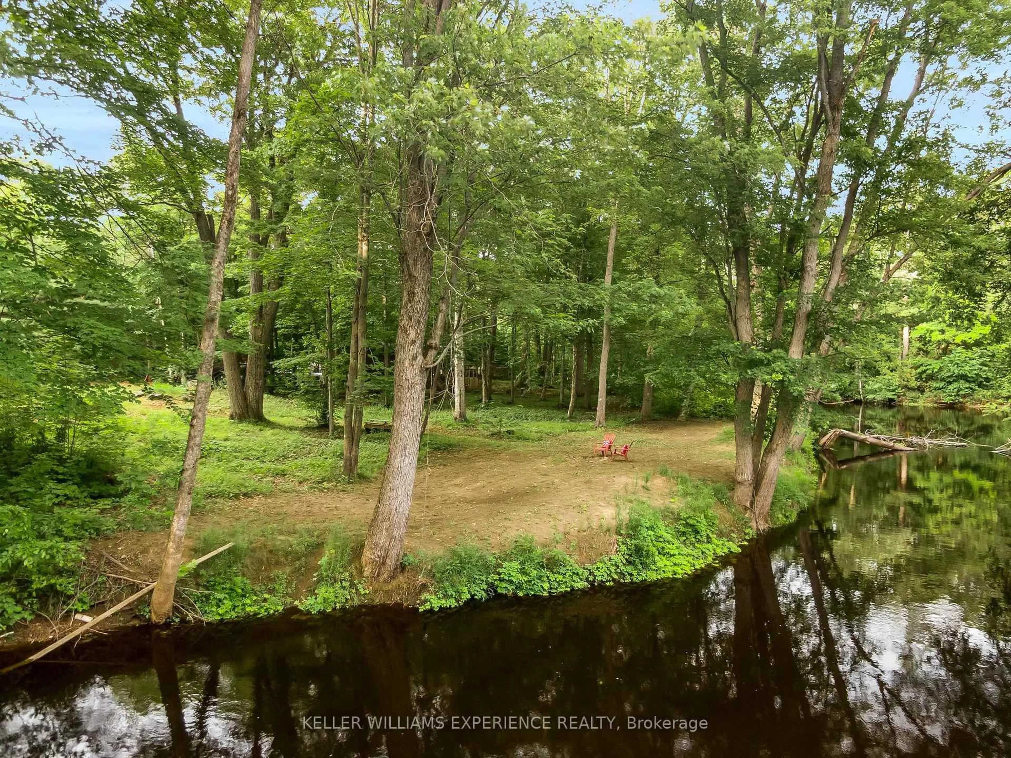 A pic from outside/outdoor area/front of a property/back of a property/a pic from drone, forest/trees view for 7516 Island Cres, Ramara Ontario L0K 2B0