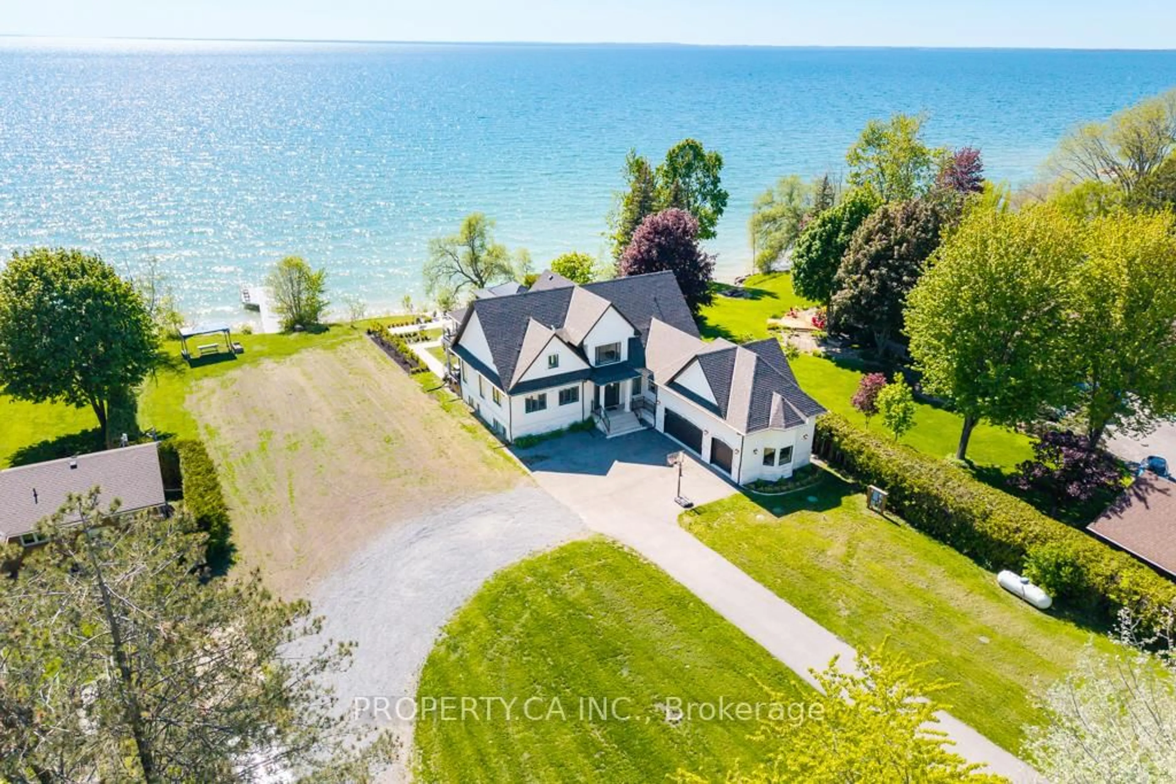 A pic from outside/outdoor area/front of a property/back of a property/a pic from drone, water/lake/river/ocean view for 1688 Lakeshore Dr, Ramara Ontario L0K 1B0