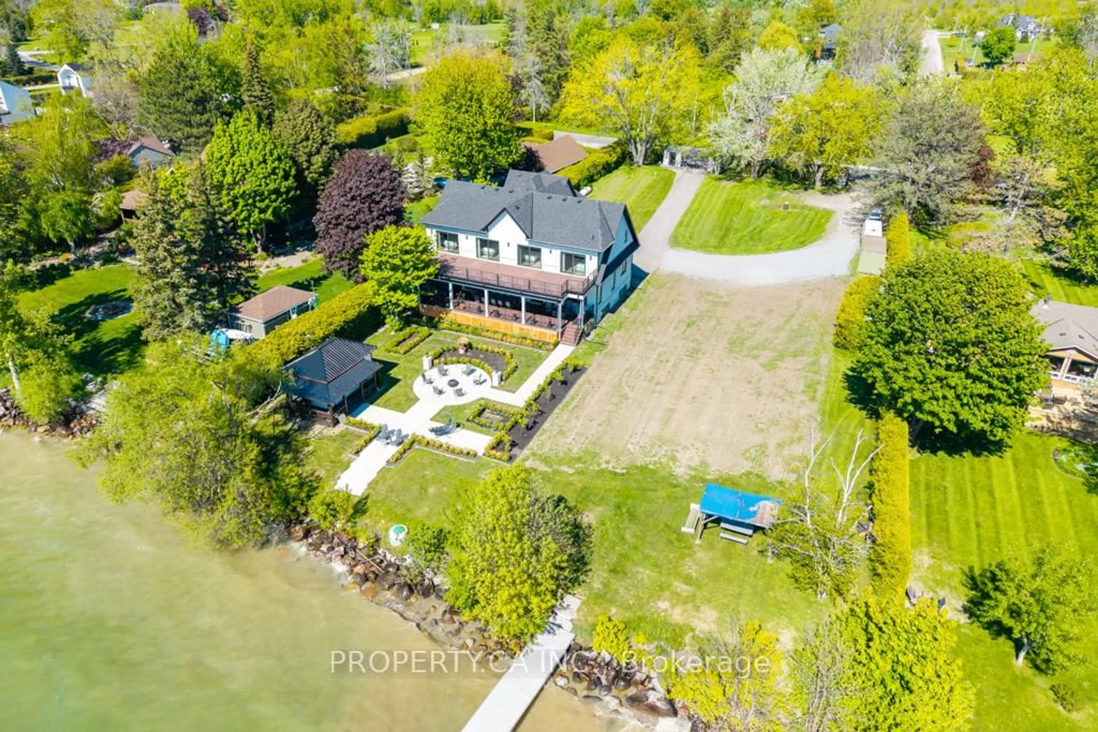 A pic from outside/outdoor area/front of a property/back of a property/a pic from drone, water/lake/river/ocean view for 1688 Lakeshore Dr, Ramara Ontario L0K 1B0