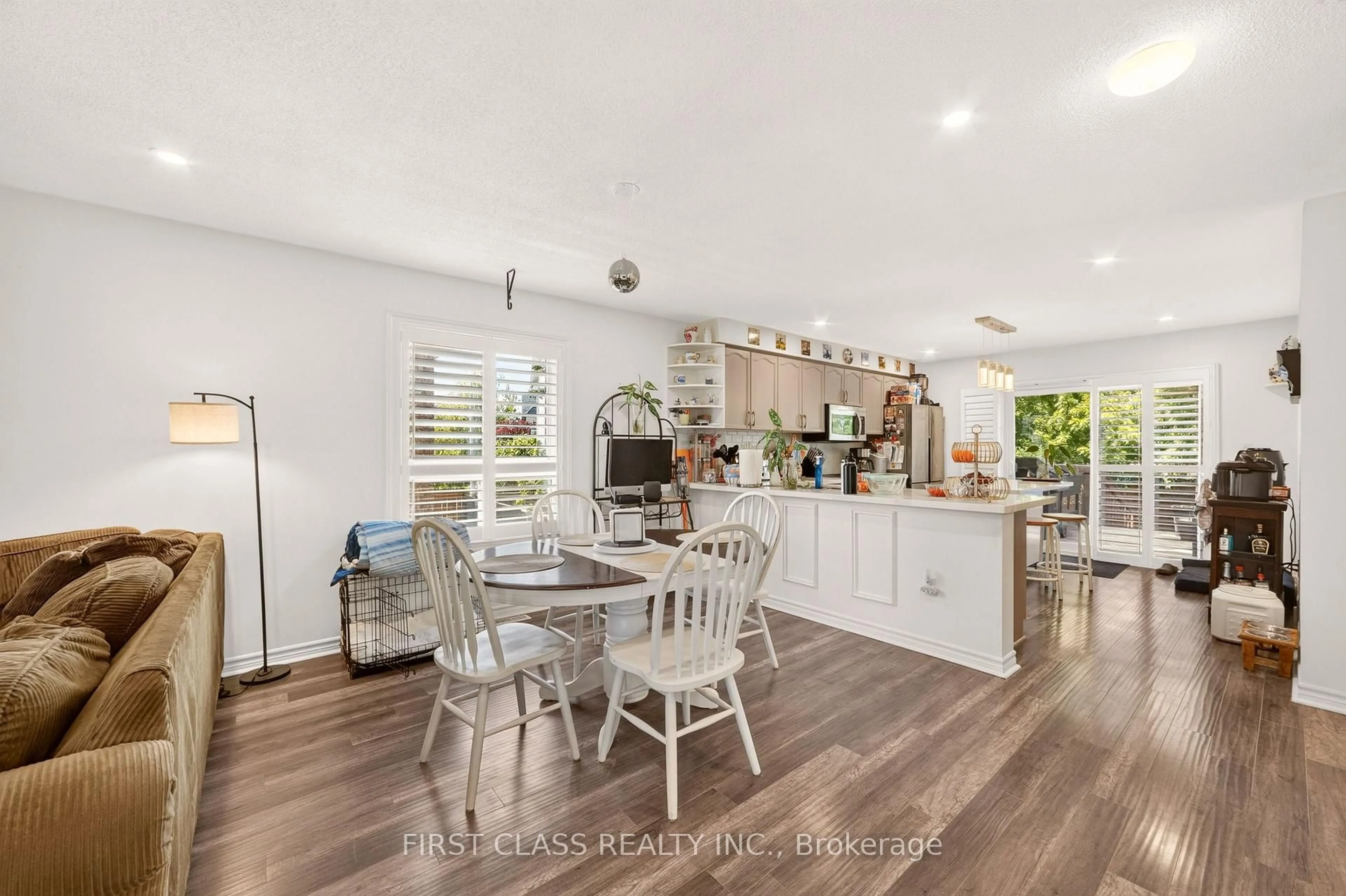 Open concept kitchen, wood/laminate floor for 115 Succession Cres, Barrie Ontario L4M 7G7