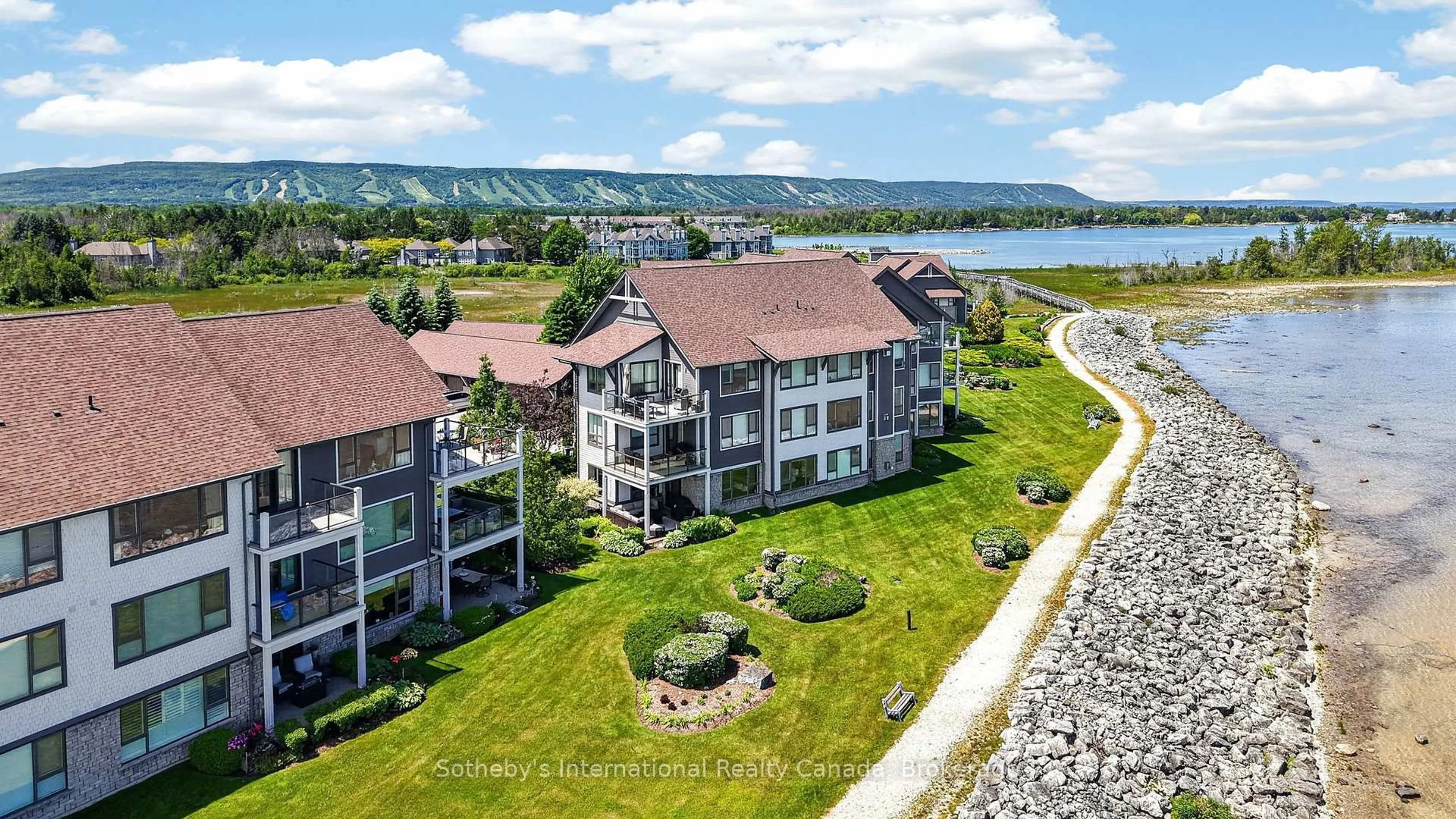 A pic from outside/outdoor area/front of a property/back of a property/a pic from drone, water/lake/river/ocean view for 555 Mariners Way, Collingwood Ontario L9Y 5C7