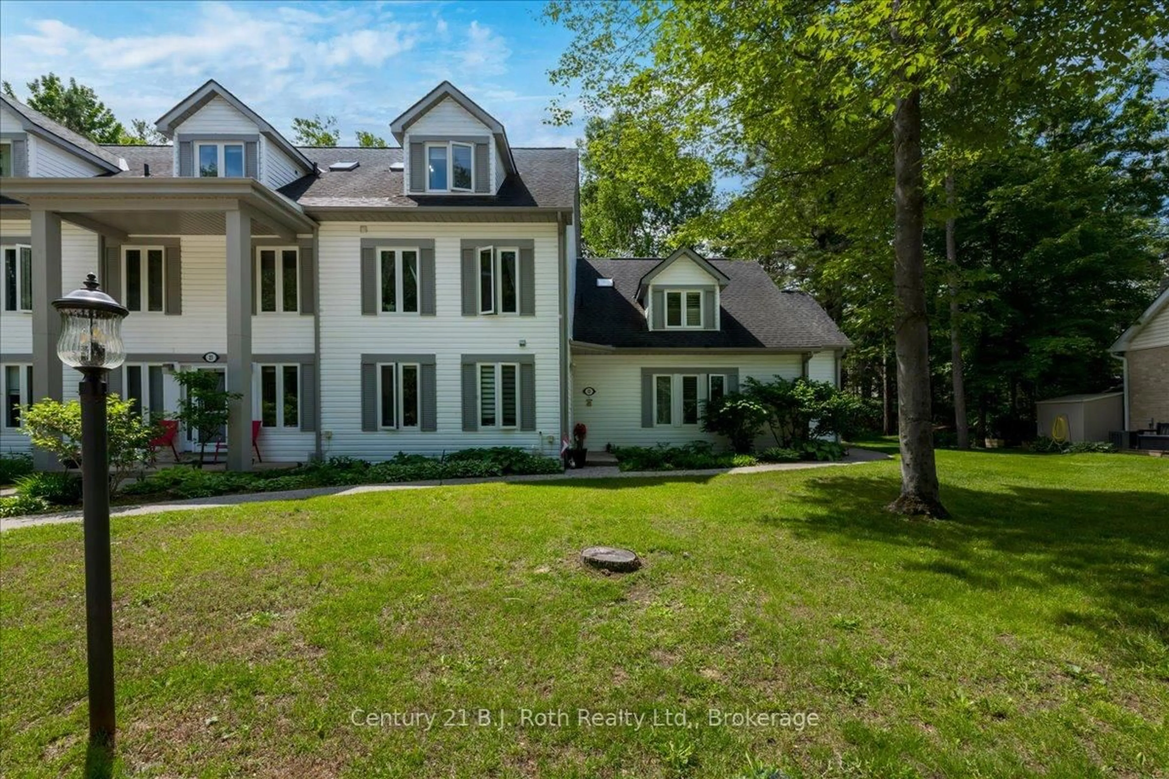 A pic from outside/outdoor area/front of a property/back of a property/a pic from drone, water/lake/river/ocean view for 22 Wasaga Woods Circ #B7, Wasaga Beach Ontario L9Z 2N1