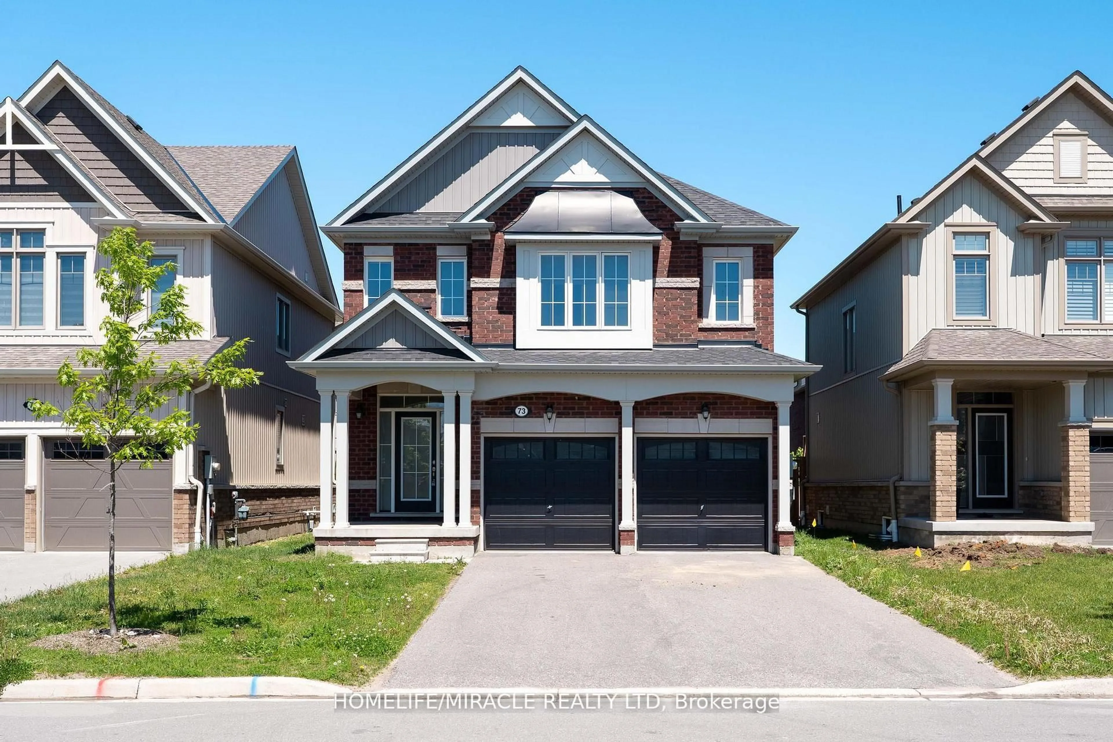 Home with brick exterior material, street for 73 Tracey Lane, Collingwood Ontario L9Y 3V2