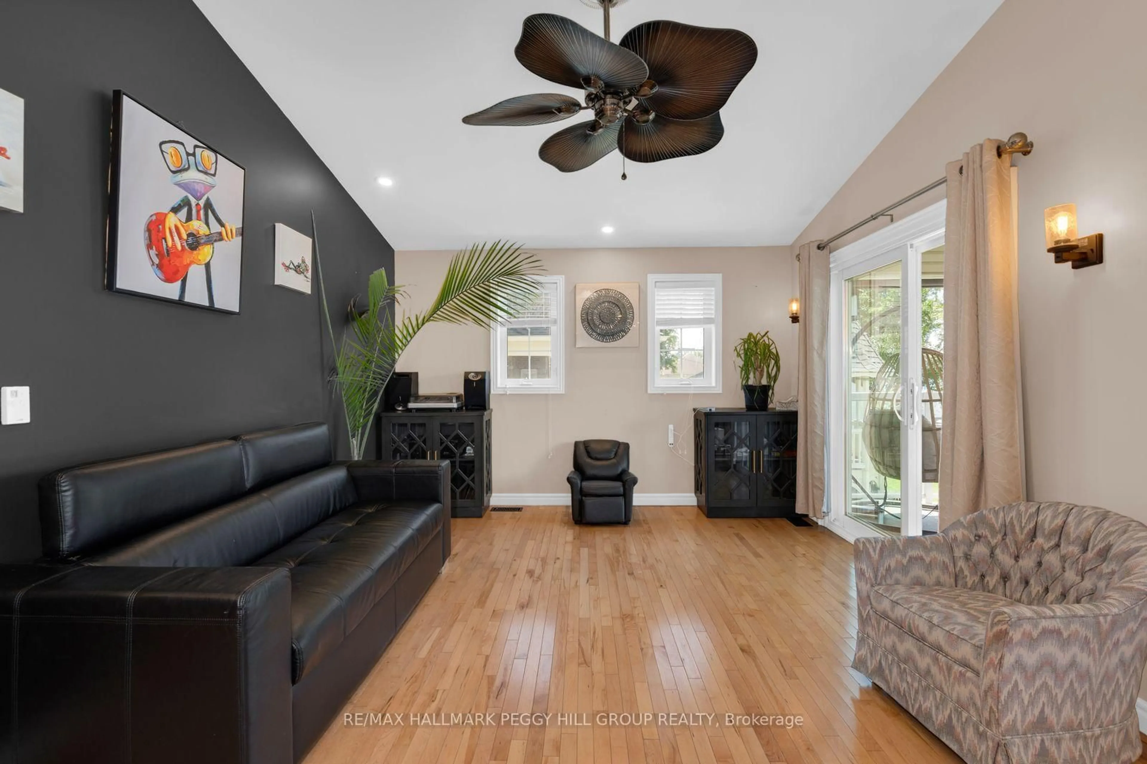 Living room with furniture, wood/laminate floor for 72 Creighton St, Ramara Ontario L3V 1B2
