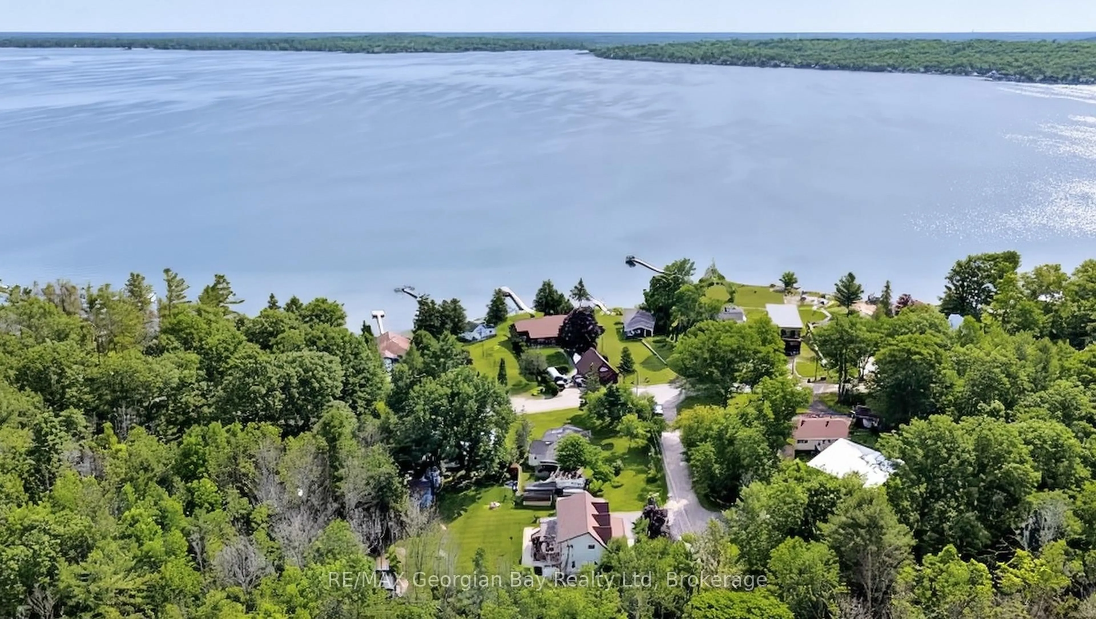 A pic from outside/outdoor area/front of a property/back of a property/a pic from drone, water/lake/river/ocean view for 4 Moore Ave, Tay Ontario L0K 2A0