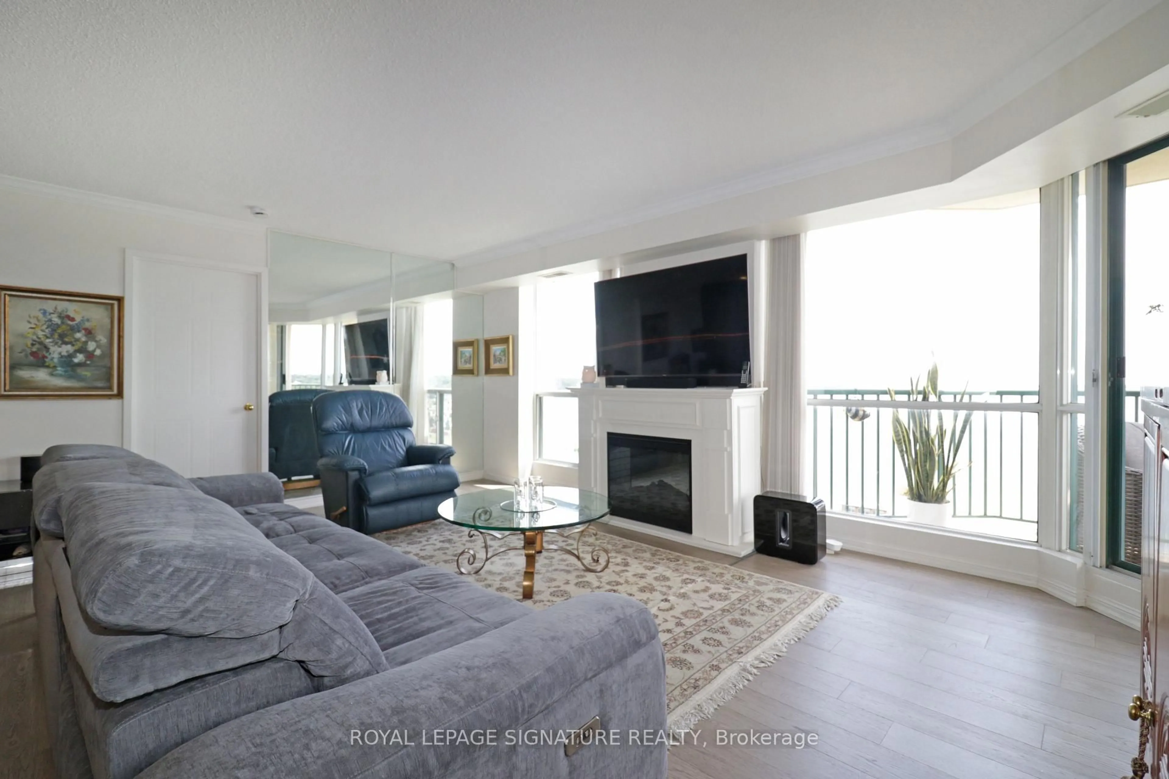Living room with furniture, unknown for 65 Ellen St #1004, Barrie Ontario L4N 3A5
