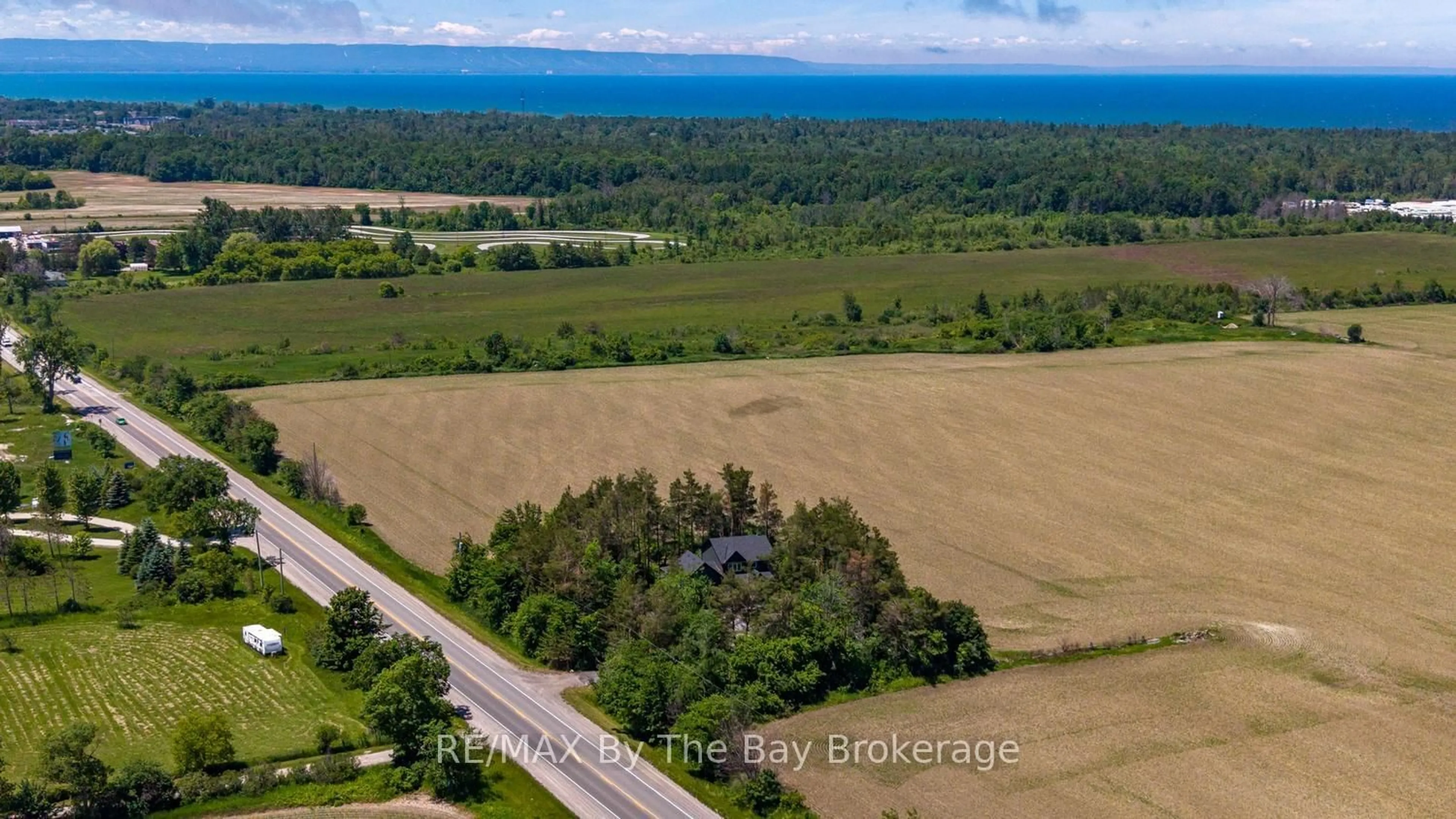 A pic from outside/outdoor area/front of a property/back of a property/a pic from drone, water/lake/river/ocean view for 2946 92 County Rd, Springwater Ontario L9Z 2X2