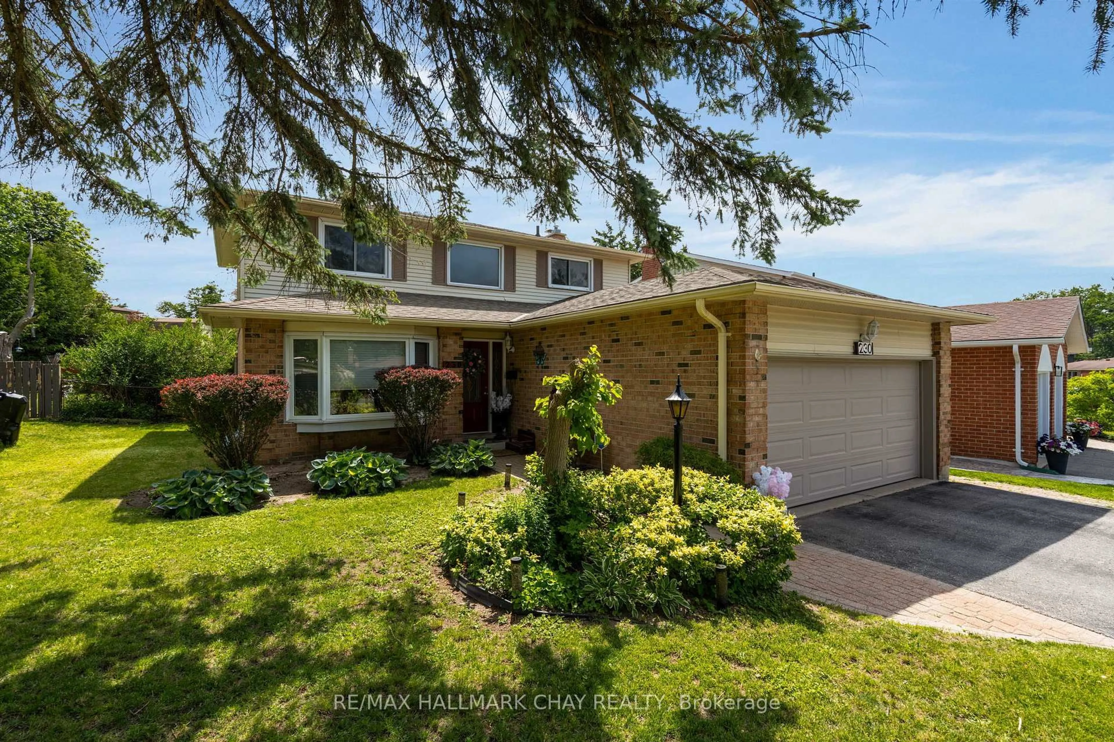 Home with brick exterior material, street for 230 Browning Tr, Barrie Ontario L4N 5J7