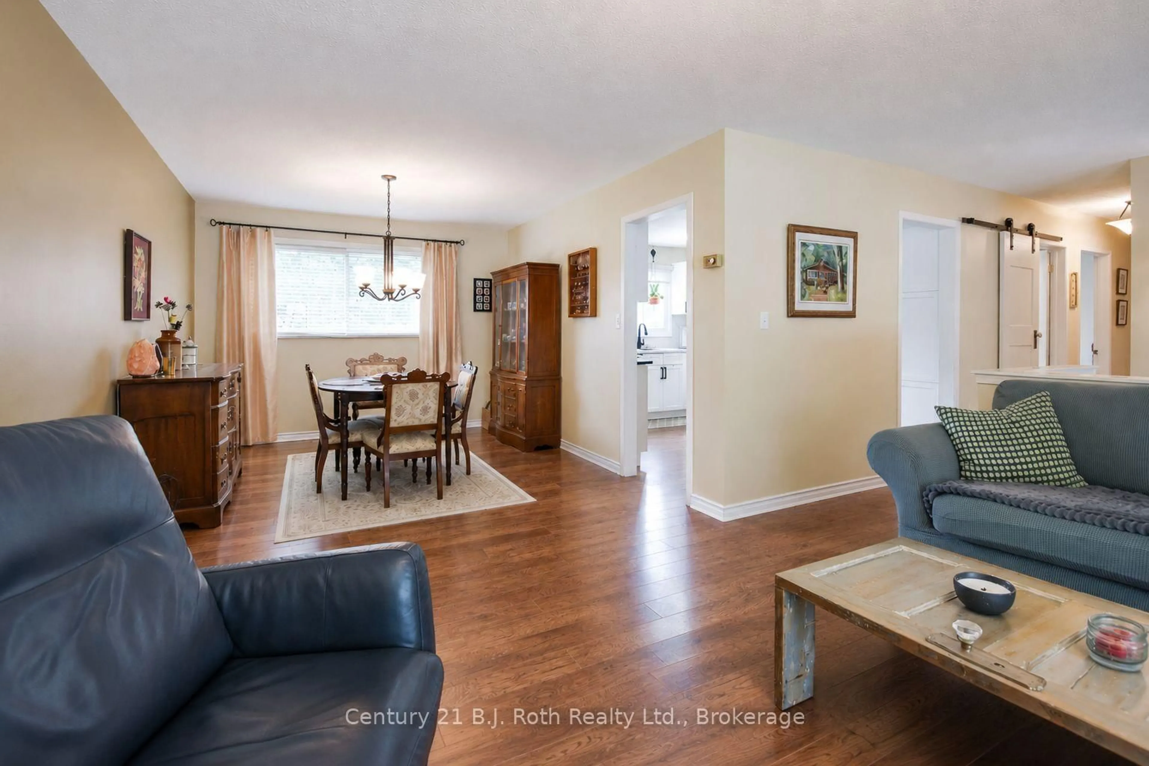Living room with furniture, wood/laminate floor for 38 Andrea Cres, Orillia Ontario L3V 6W5