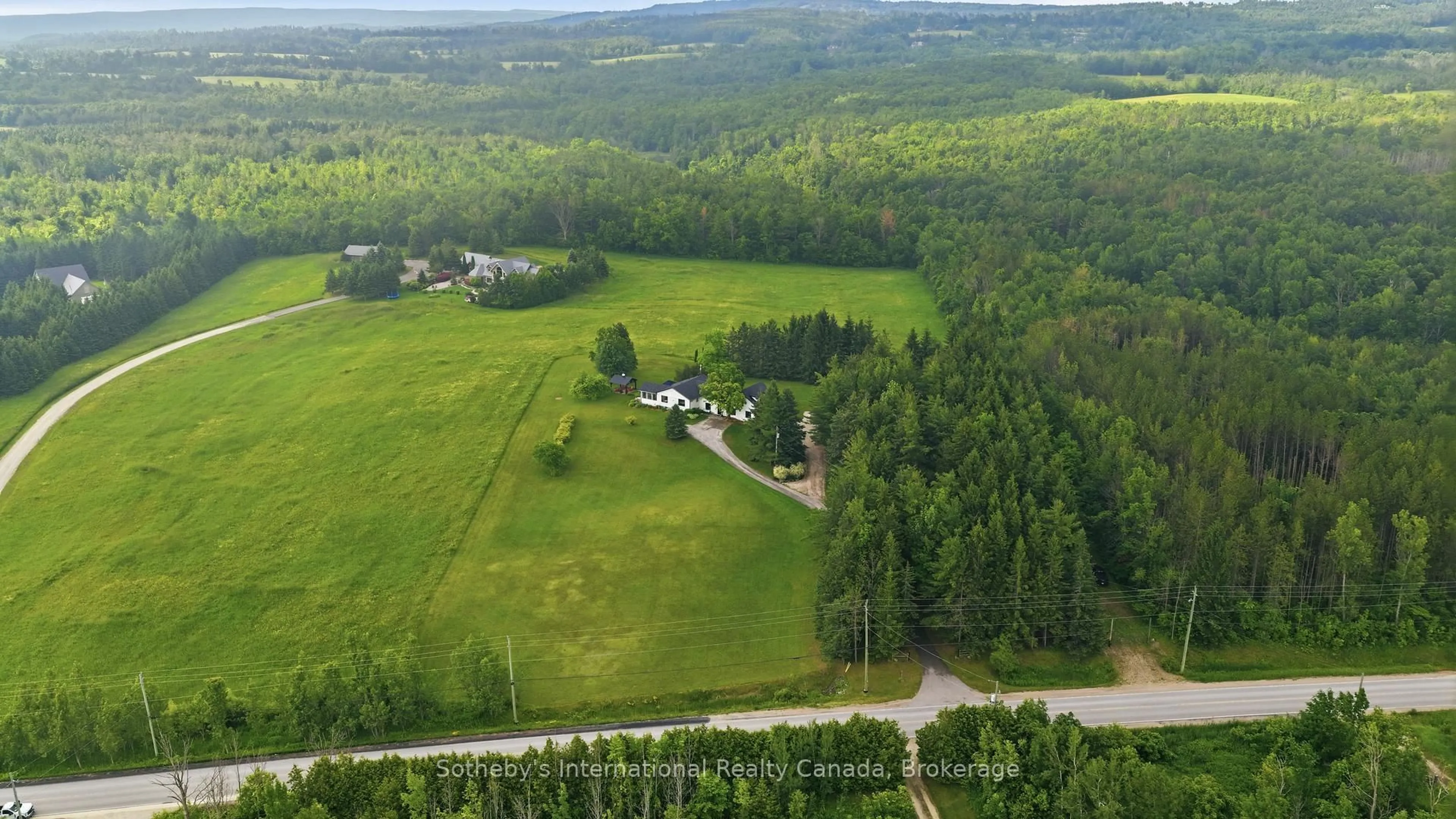 A pic from outside/outdoor area/front of a property/back of a property/a pic from drone, forest/trees view for 9263 91 County Rd, Clearview Ontario L0M 1H0