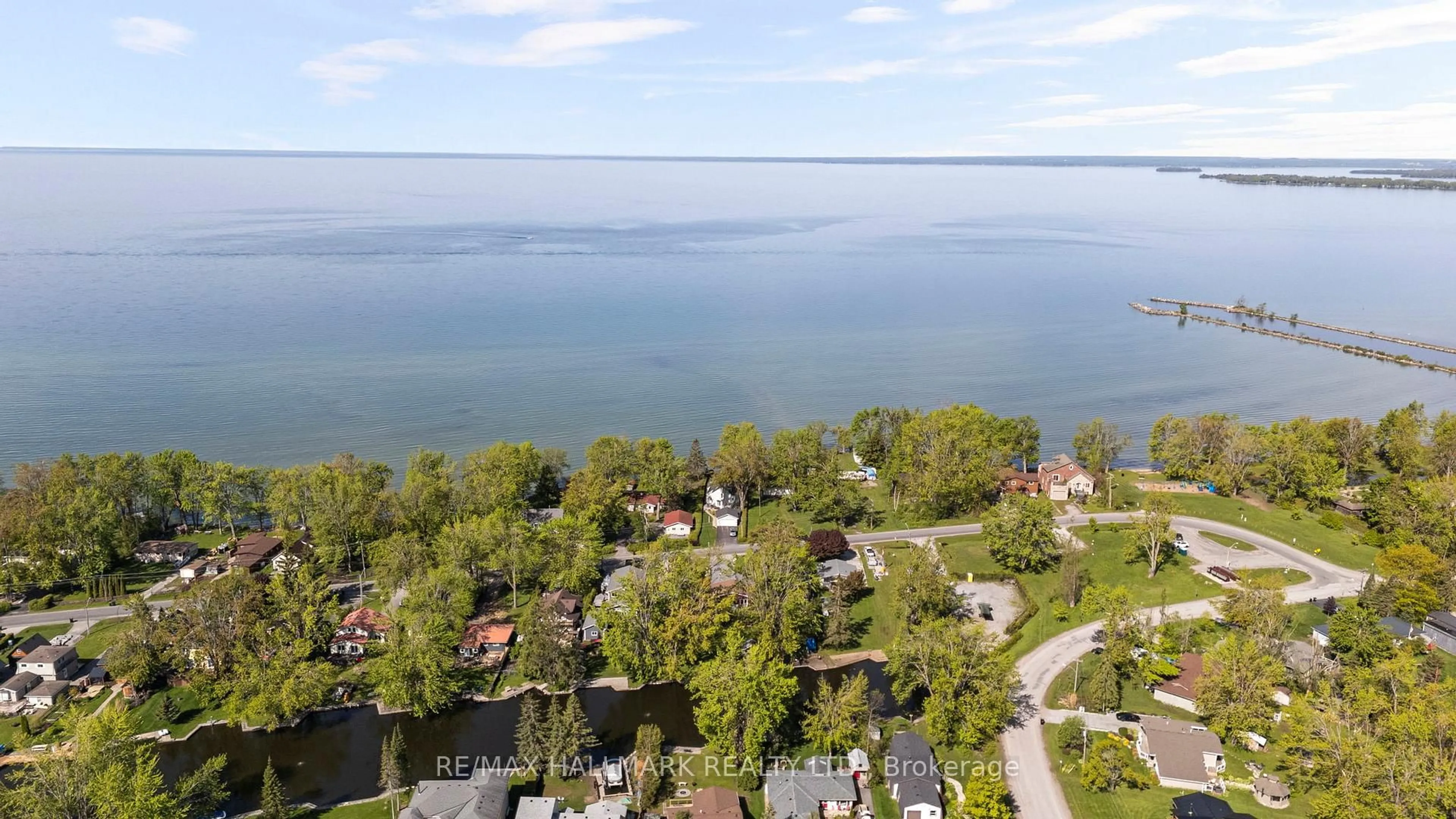 A pic from outside/outdoor area/front of a property/back of a property/a pic from drone, water/lake/river/ocean view for 95 Lake Ave, Ramara Ontario L0K 1B0