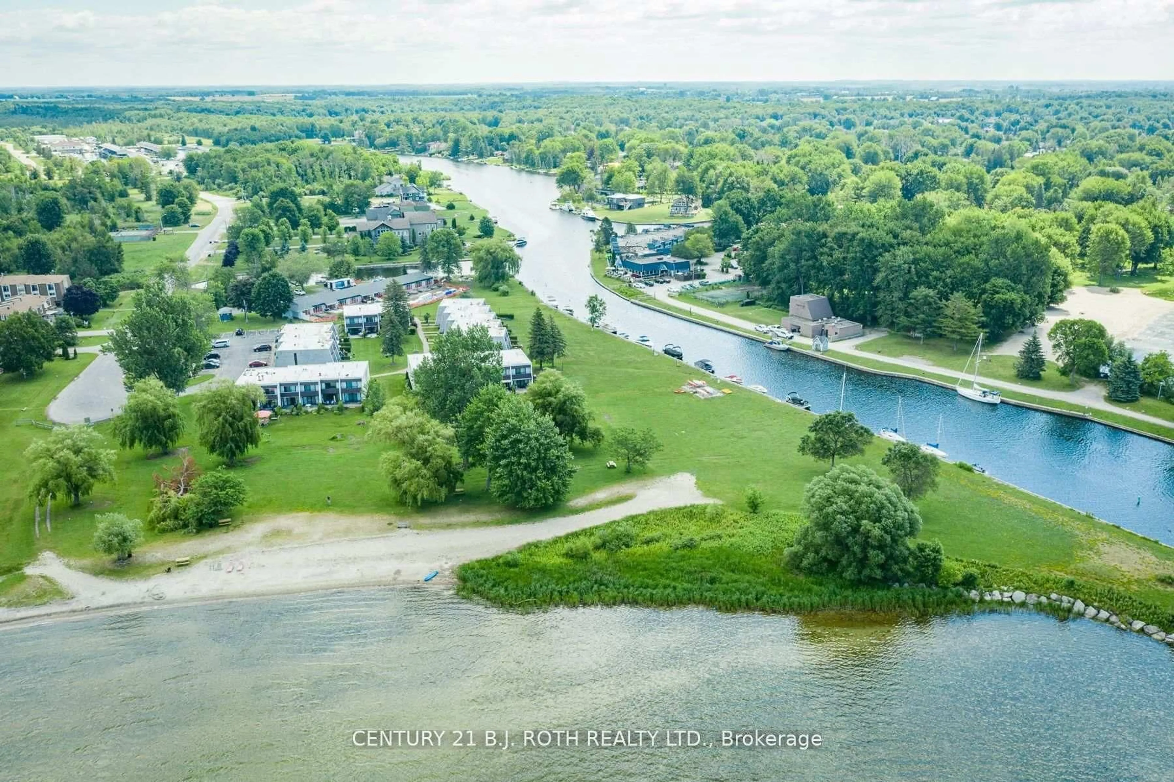 A pic from outside/outdoor area/front of a property/back of a property/a pic from drone, water/lake/river/ocean view for 1 Paradise Blvd #Unit 29, Ramara Ontario L0K 1B0
