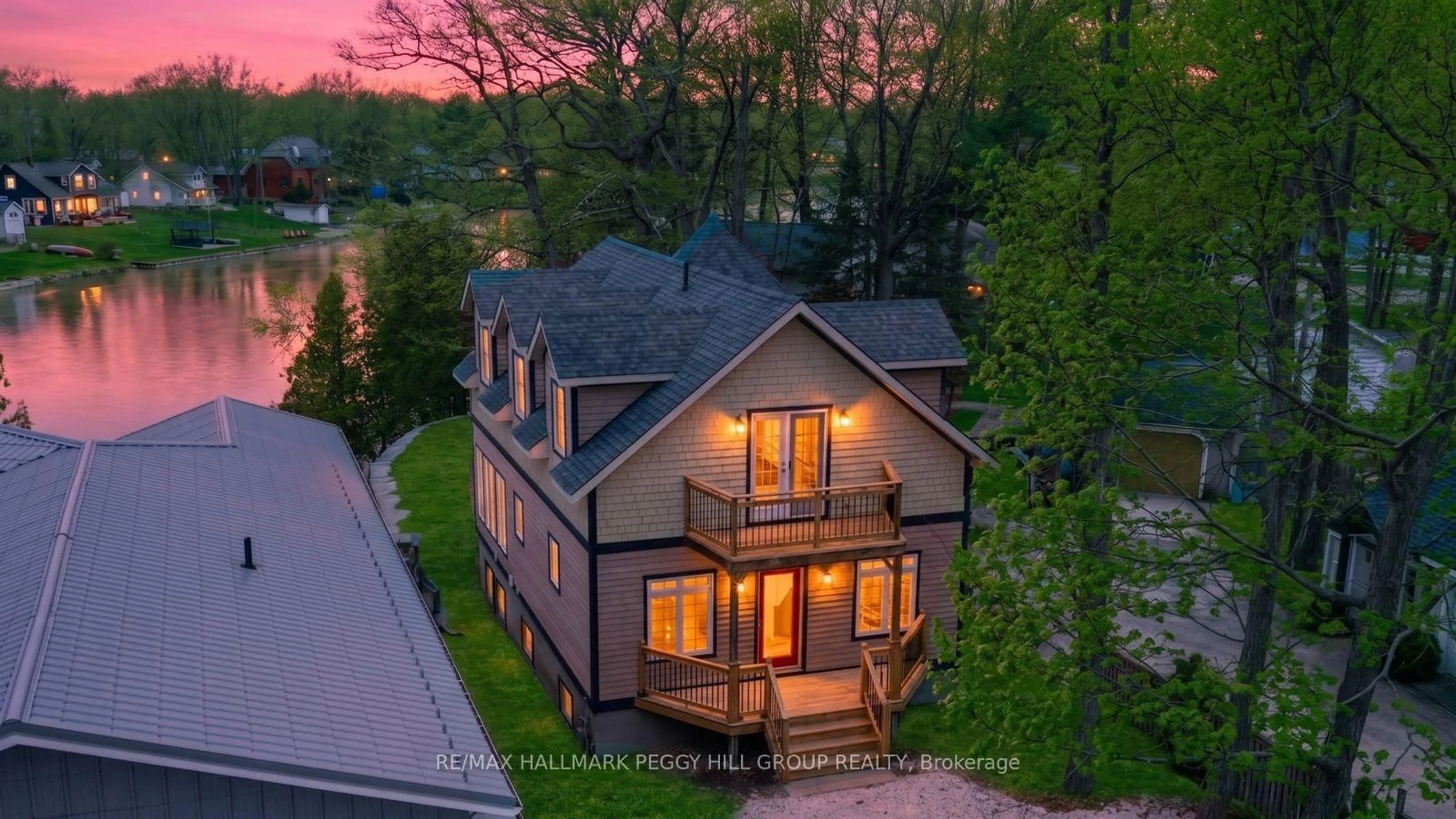 A pic from outside/outdoor area/front of a property/back of a property/a pic from drone, street for 2026 River Rd, Wasaga Beach Ontario L9Z 2W1