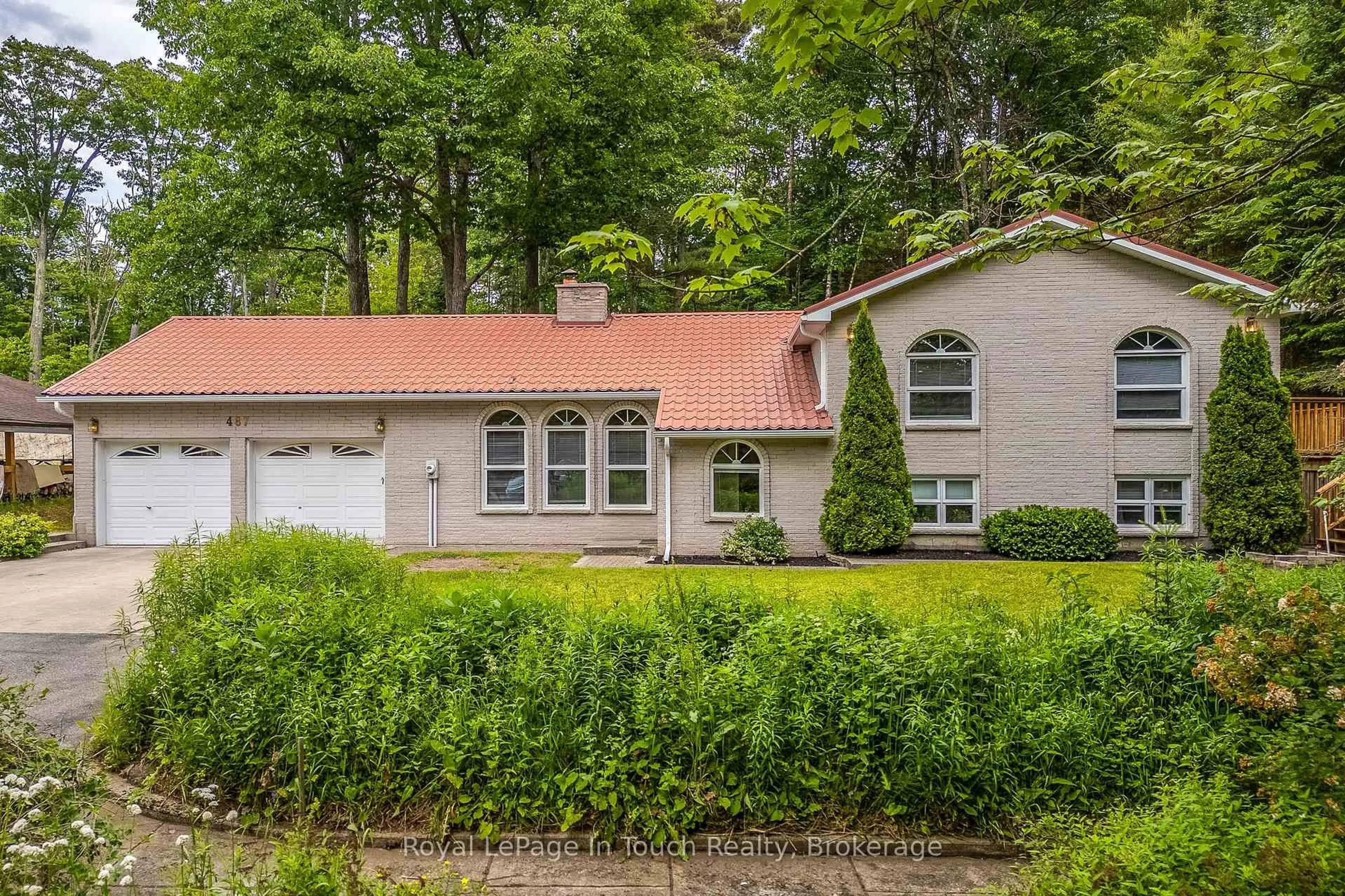 Home with vinyl exterior material, street for 487 Tiny Beaches Rd, Tiny Ontario L0L 2T0