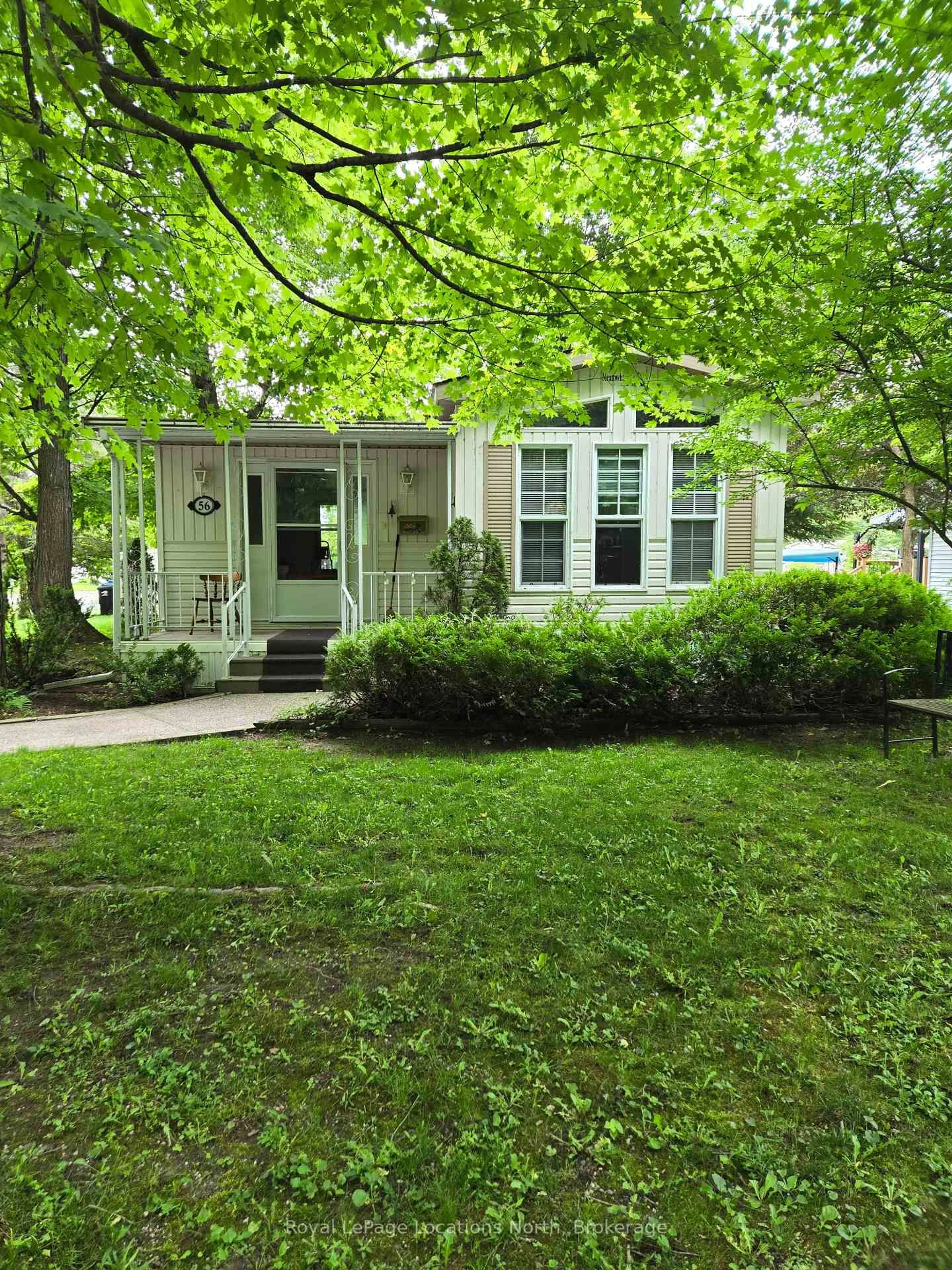Home with vinyl exterior material, street for 56 The Boardwalk, Wasaga Beach Ontario L9Z 3A8