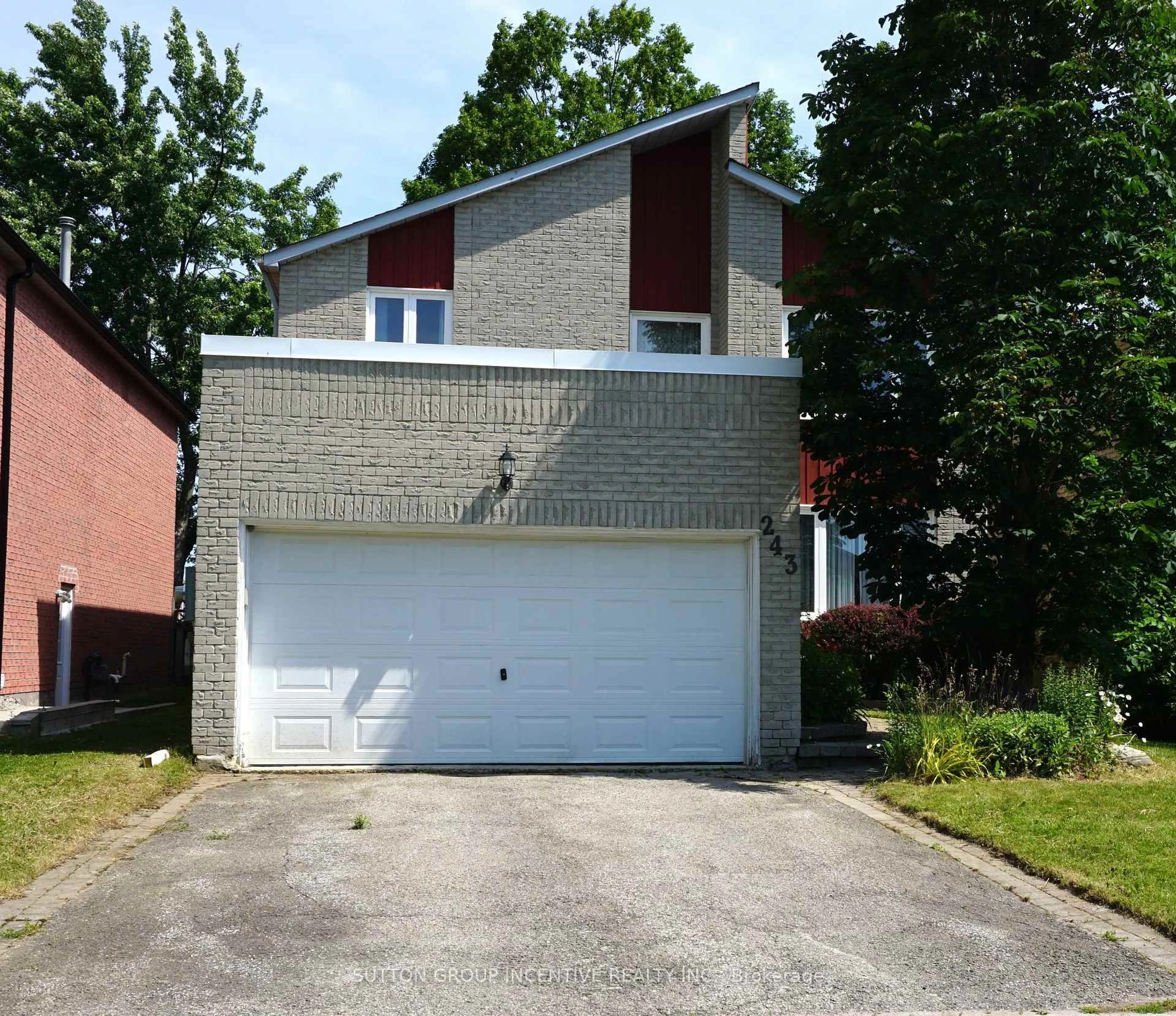 Home with brick exterior material, street for 243 Hickling Tr, Barrie Ontario L4M 5W9