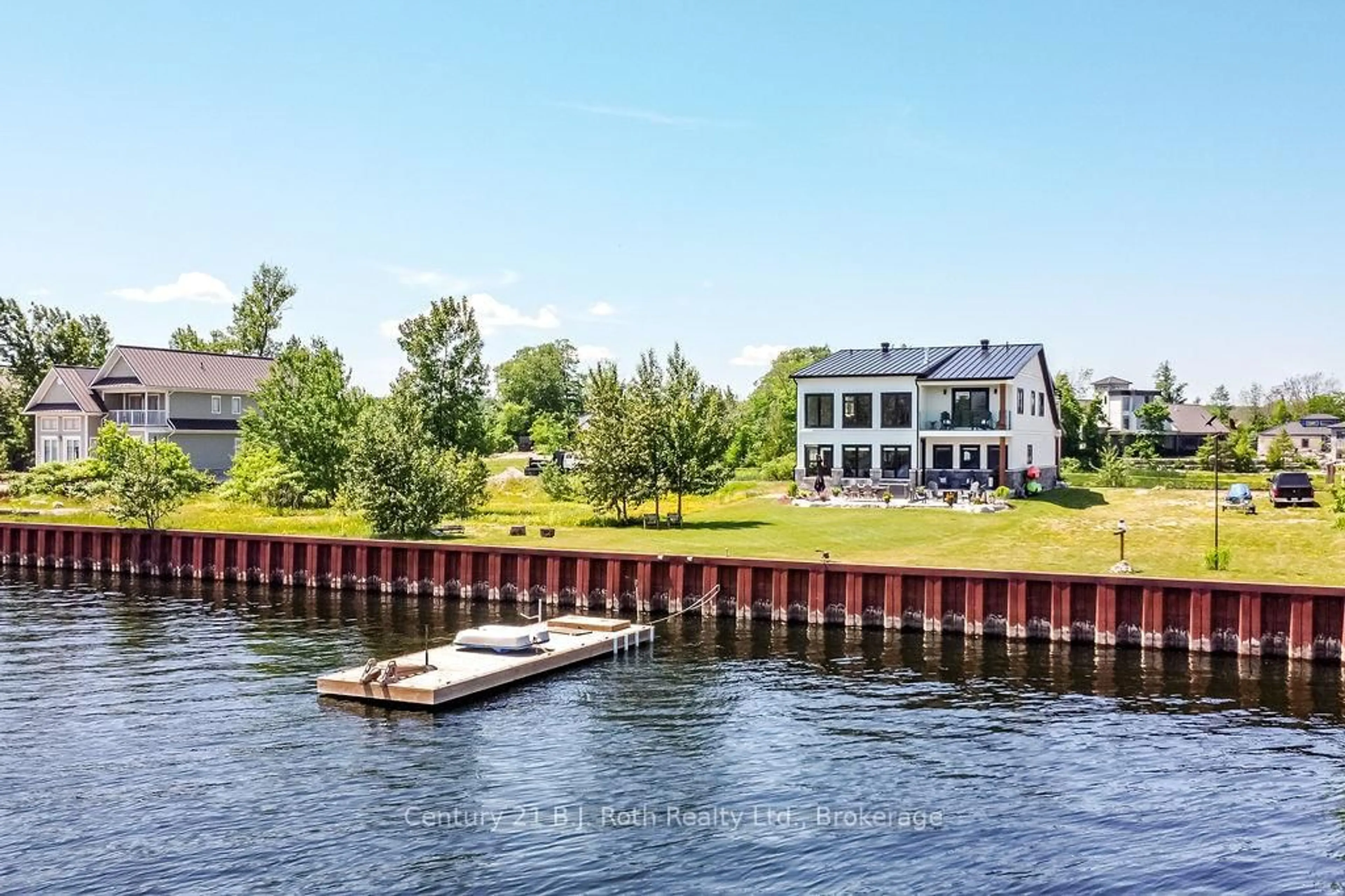 A pic from outside/outdoor area/front of a property/back of a property/a pic from drone, water/lake/river/ocean view for 53 Dock Lane #27, Tay Ontario L0K 1R0