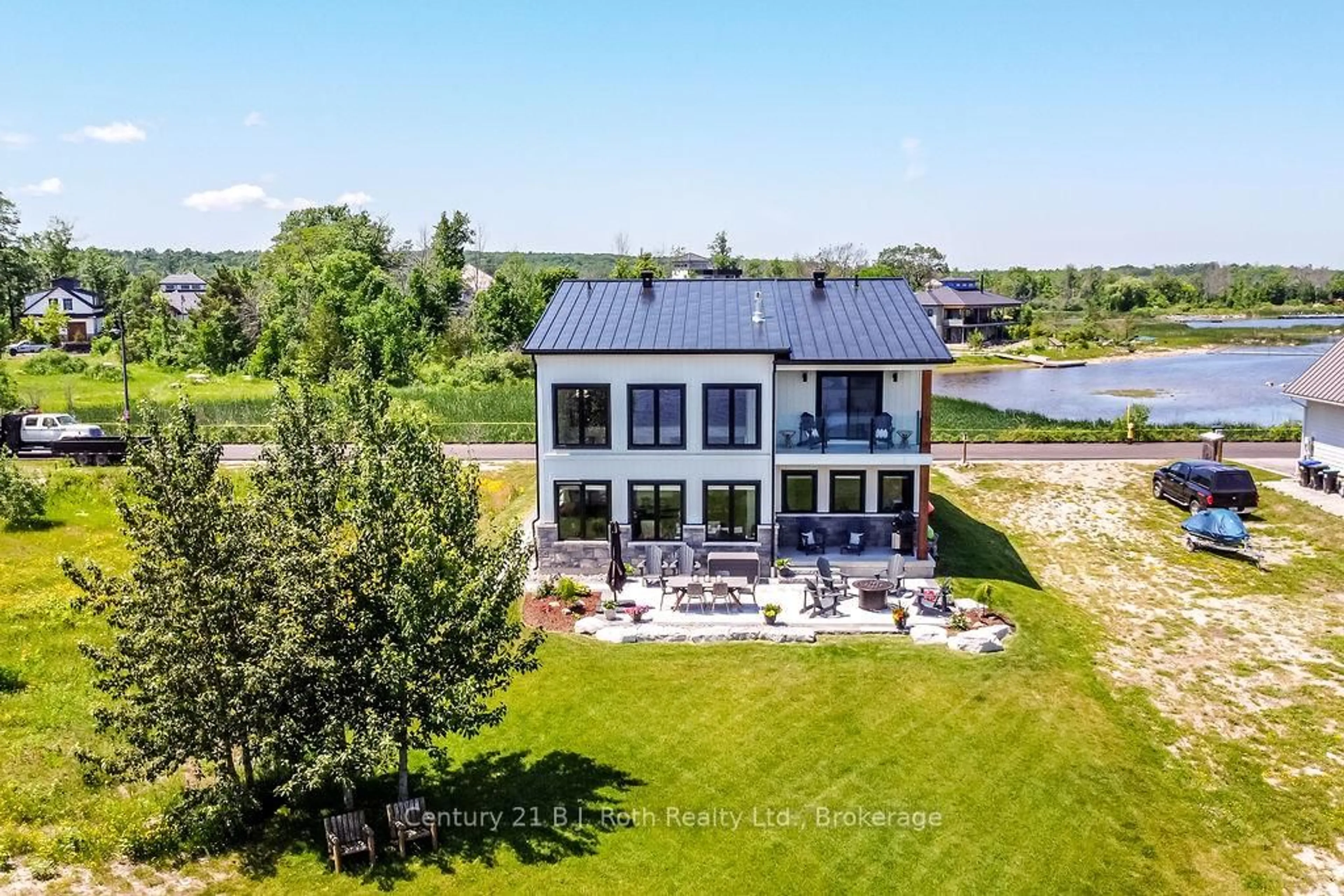 A pic from outside/outdoor area/front of a property/back of a property/a pic from drone, water/lake/river/ocean view for 53 Dock Lane #27, Tay Ontario L0K 1R0