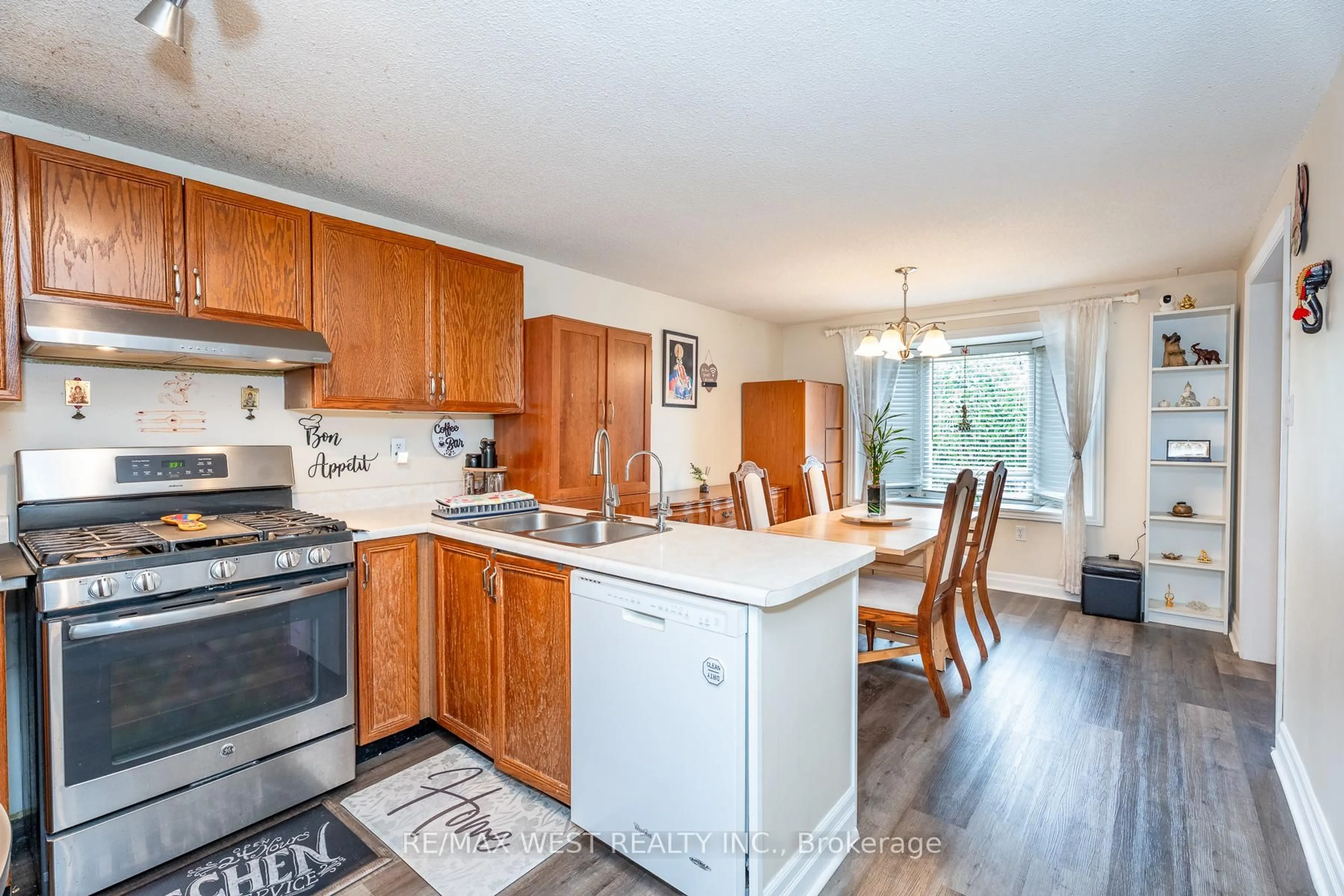 Open concept kitchen, wood/laminate floor for 369 Galloway Blvd, Midland Ontario L4R 5C1