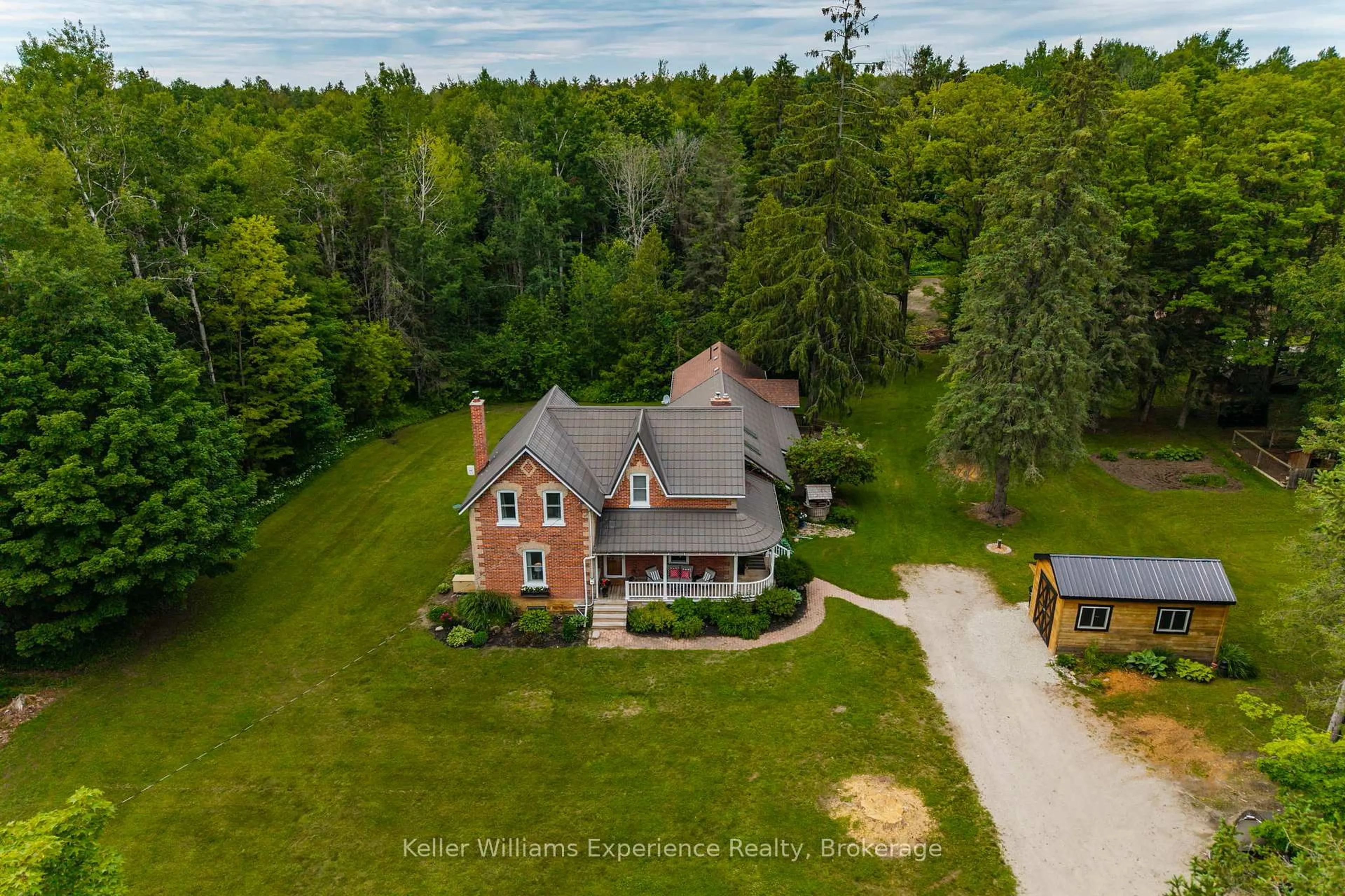 A pic from outside/outdoor area/front of a property/back of a property/a pic from drone, unknown for 3744 Flos 4 Rd, Springwater Ontario L0M 1S0