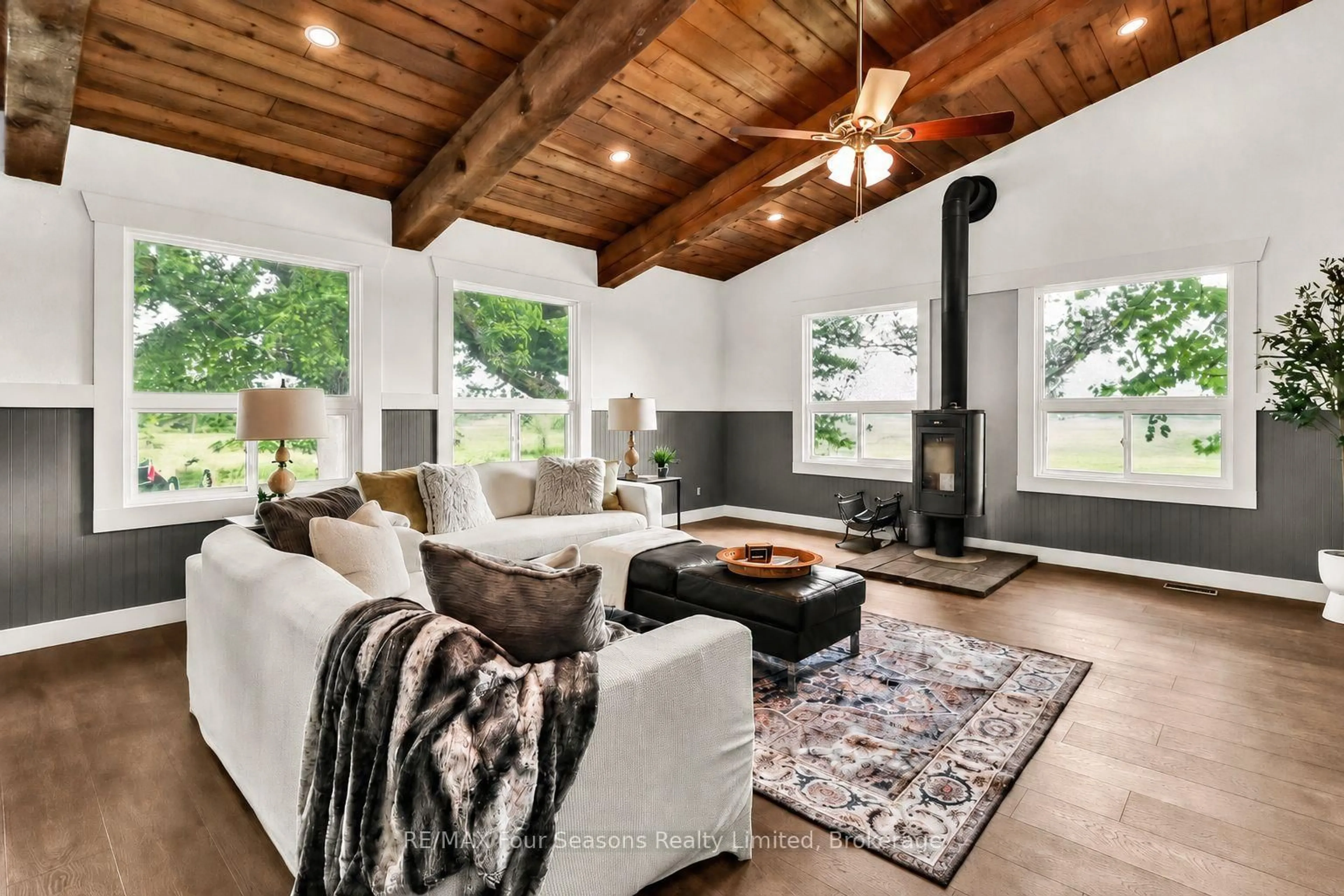 Living room with furniture, wood/laminate floor for 7363 Sideroad 33 34 Rd, Clearview Ontario L0M 1S0