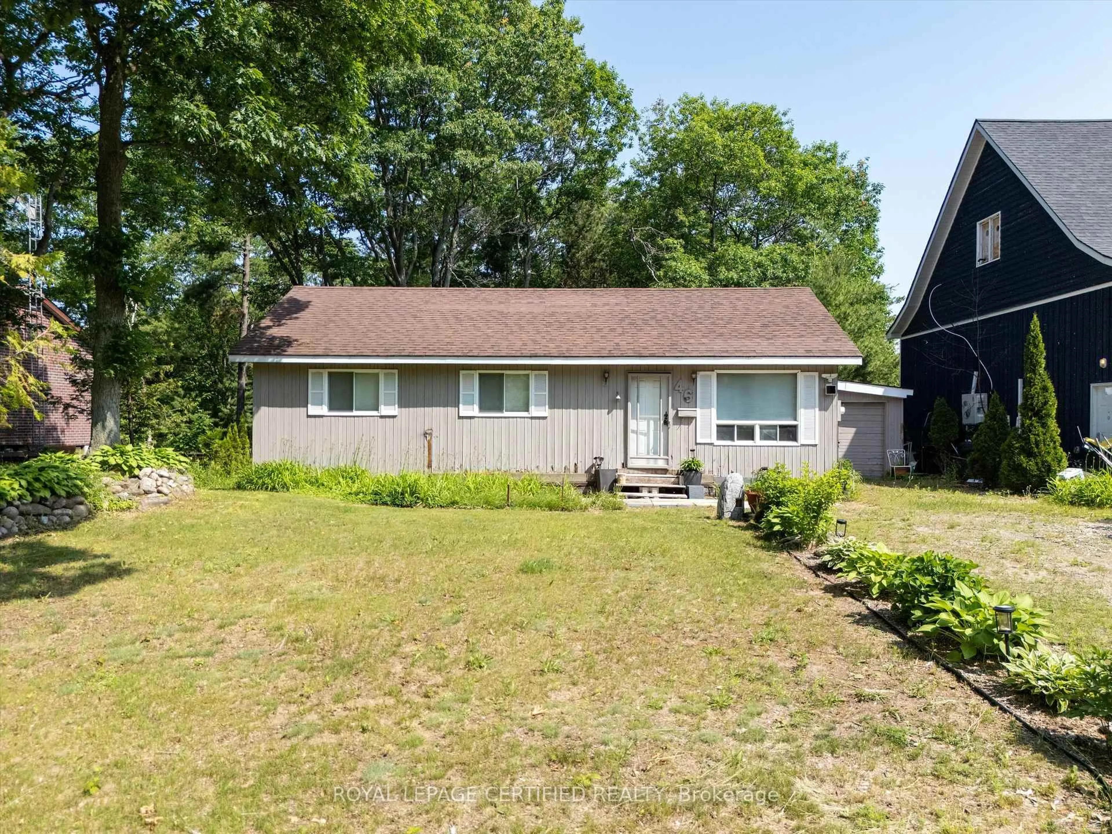 A pic from outside/outdoor area/front of a property/back of a property/a pic from drone, street for 46 Tucson Rd, Tiny Ontario L9M 0B6