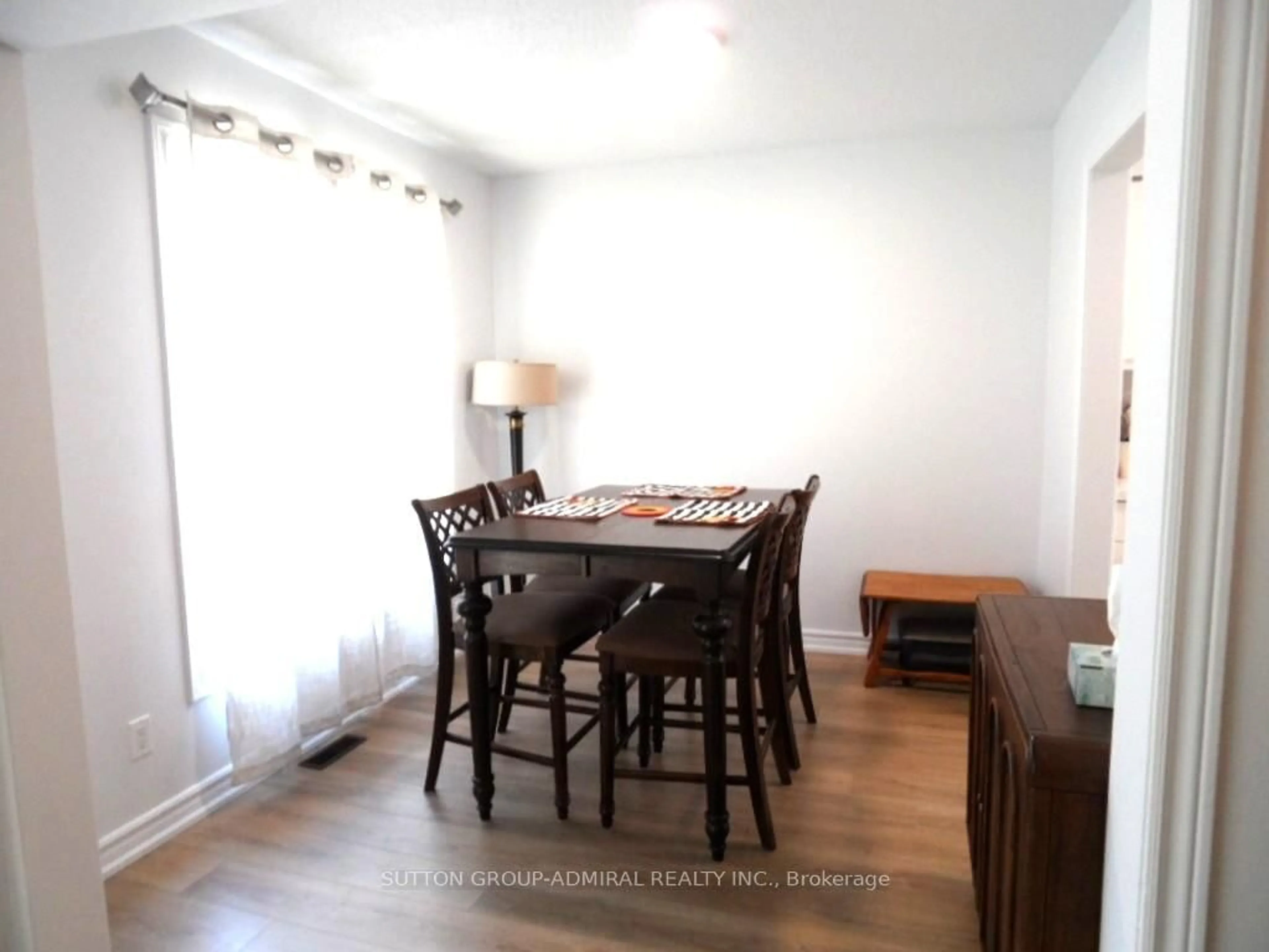 Dining room, wood/laminate floor for 65 Delaney Cres, Barrie Ontario L4N 7C4